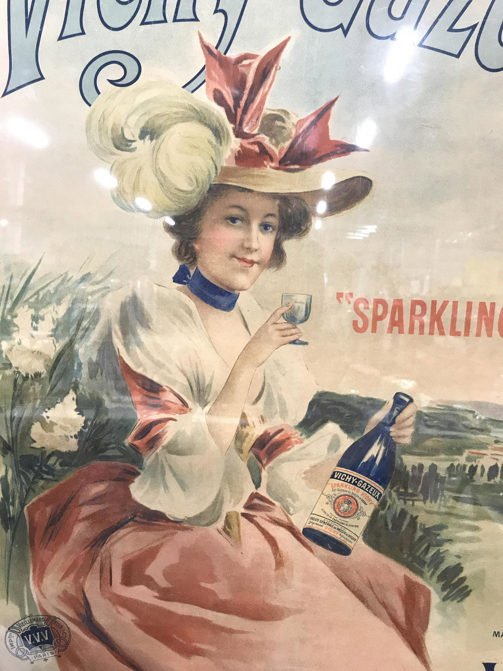 Oversized Vichy Gazeux Vintage Lithograph Poster: Vichy Gazeux Vintage lithograph, French sparkling water company, subject includes a woman in French Rococo Attire holding a glass and bottle of Vichy Gazeux sparkling water on a hillside, poster reads