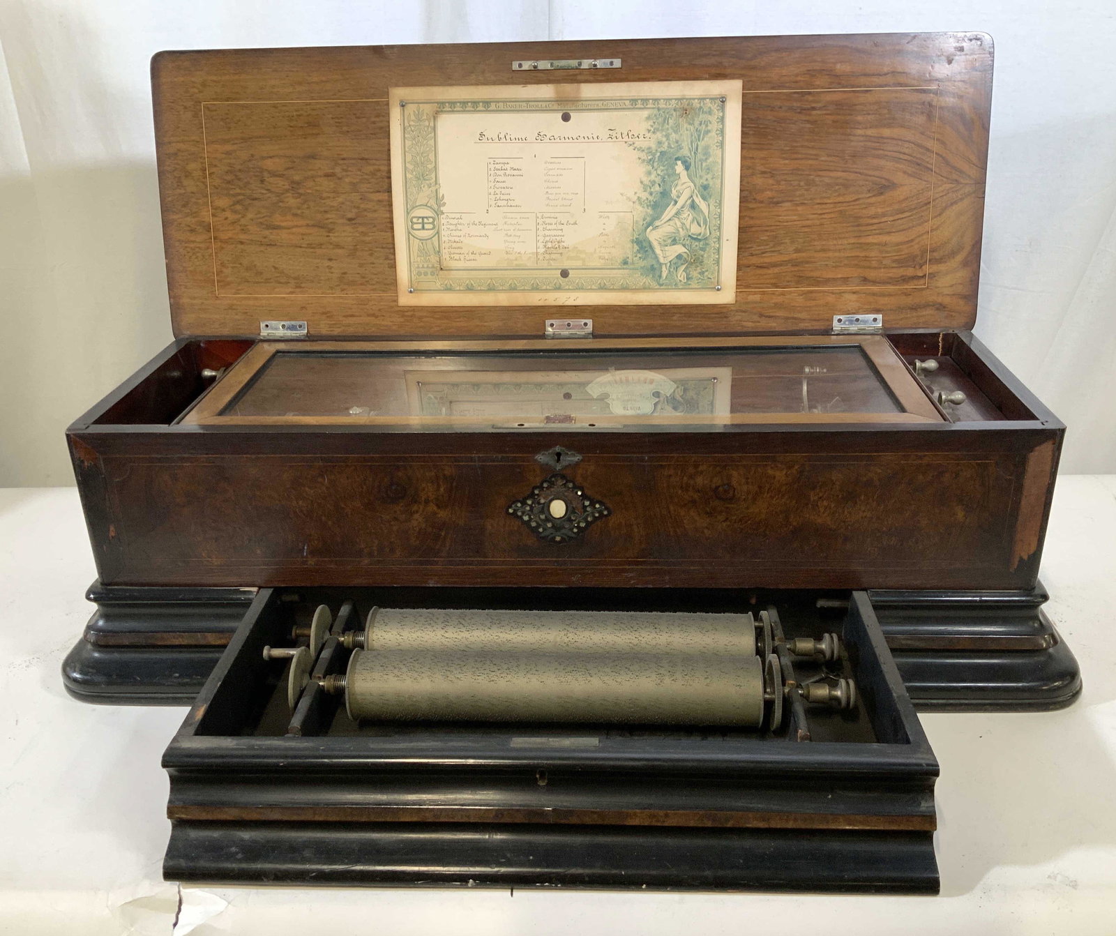 G. BAKER-TROLL&Co, Geneva Antique Music Box: Swiss Cylinder Music Box Measures ht 11 inches, length 34 inches depth with drawer closed 15 inches, Swiss Interchangeable Cylinder Music Box by George Baker Troll and Company, Geneva, believe case is