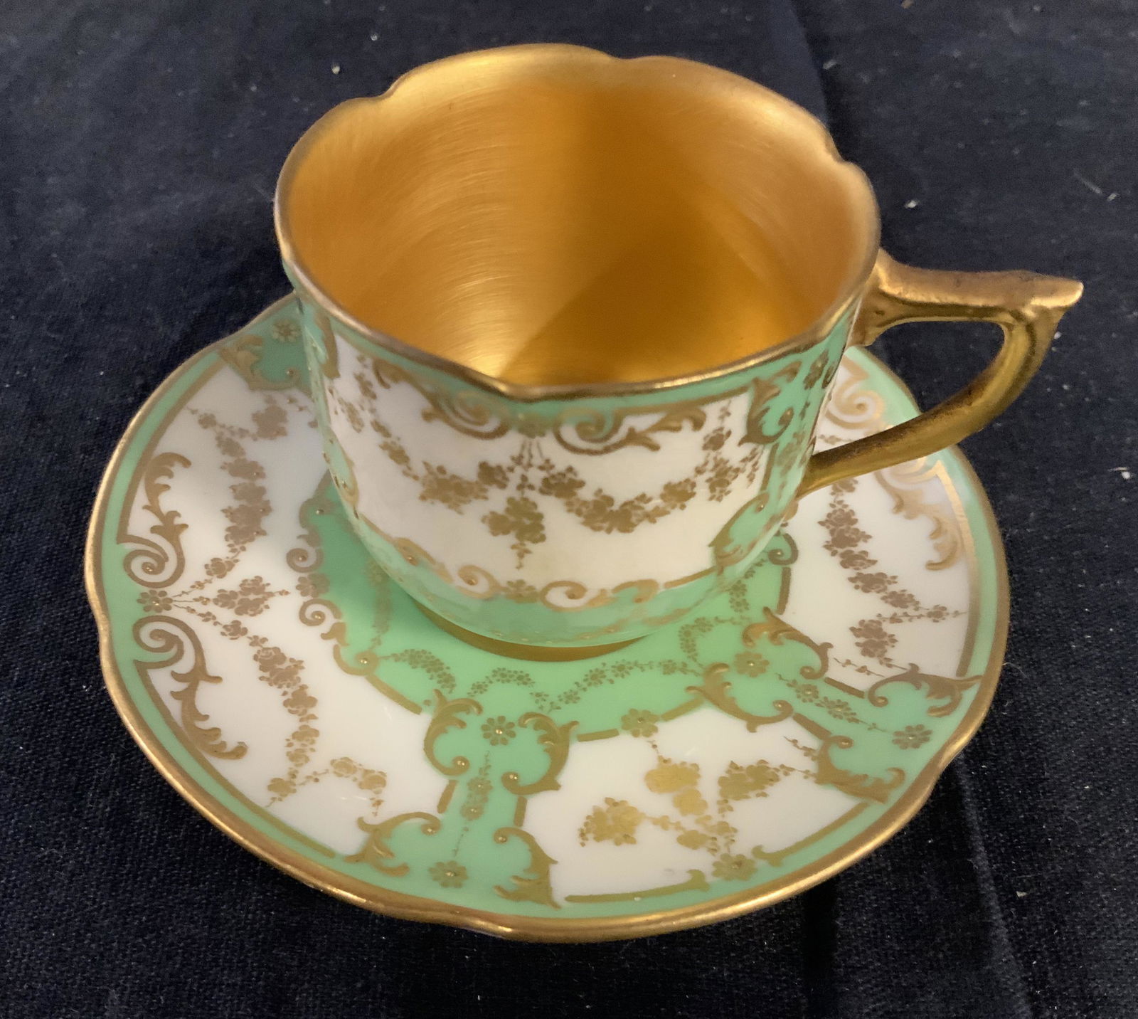 Antique Royal Doulton Gilded Cup Saucer: English porcelain, Antique porcelain, individual tea coffee service, marked underside, tea cup and saucer hand painted gold accents measures ht 2 inches diameter 4 inches