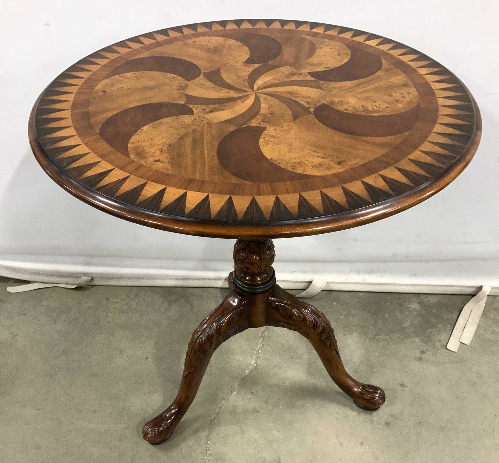 Theodore Alexander Multi Wood Circular End Table: Pedestal base, splayed thee legs and geometric pattern of different woods on circular top, ht measures app 28 inches, diameter app 27 inches, end table, side table, occasional table, decorative arts