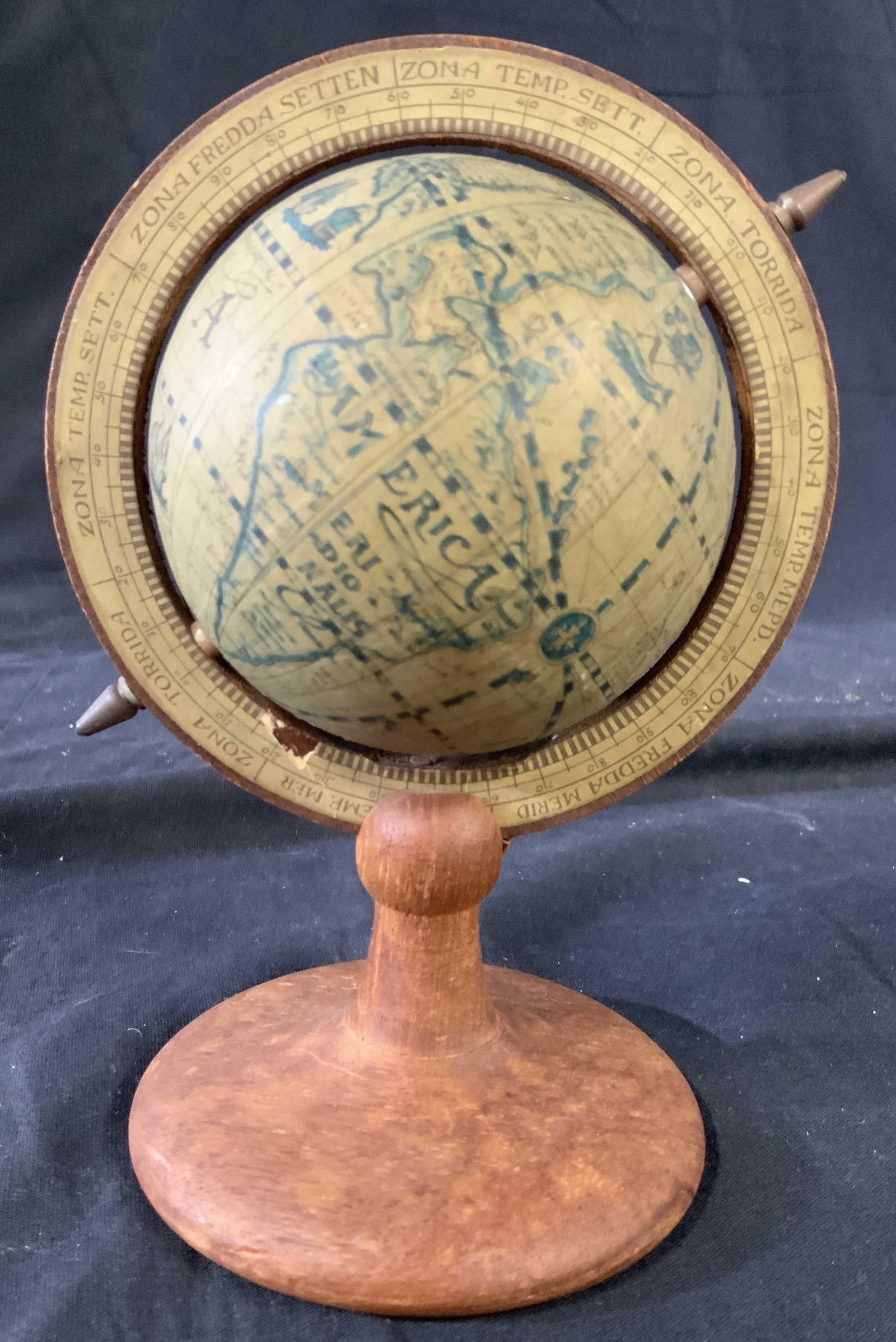 Vintage Wood Spinning Globe on Stand: Diagonal on axis, collectible, vintage glaze, desk top accessory, decorative objects, measures ht app 8 inches width app 7 inches axis, decorative arts and crafts, has wear, possibly made in Italy
