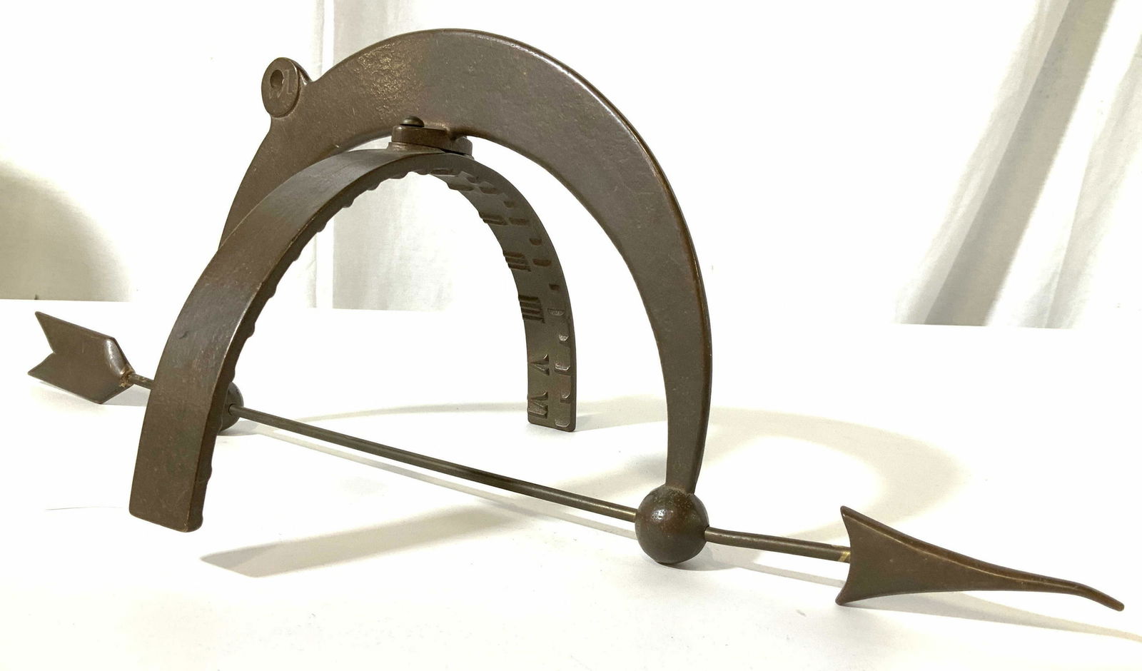 Painted Iron Armillary Hemisphere Sundial: Armillary Sundial. Glazed iron metal, hand wrought, hand crafted, double ring armillary with directional arrow, inside of flat ring, has raised Roman numerals and markings, indoor or out door decorati