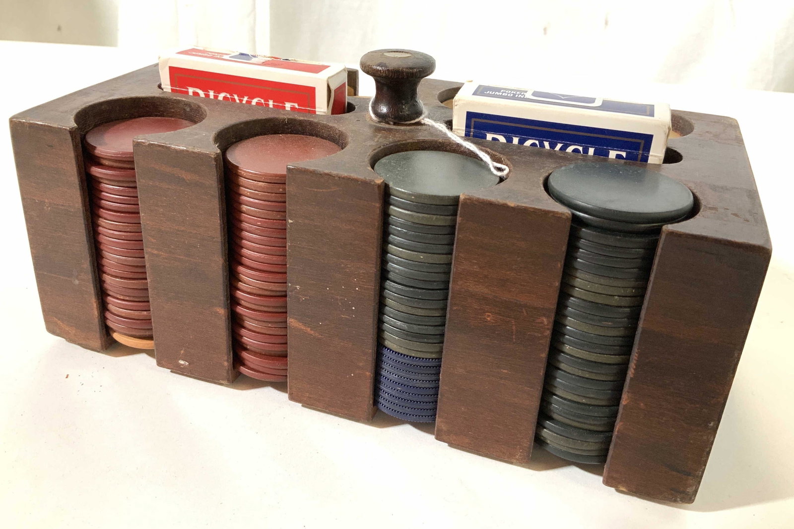 Collectible Boxed Poker Chip Card Carry All Set: Vintage set of wood box with segmented areas holding vintage stacked poker chips, game chips, center slots hold two boxed set of cards, carry knob with wood and metal finial, collectible game accessor