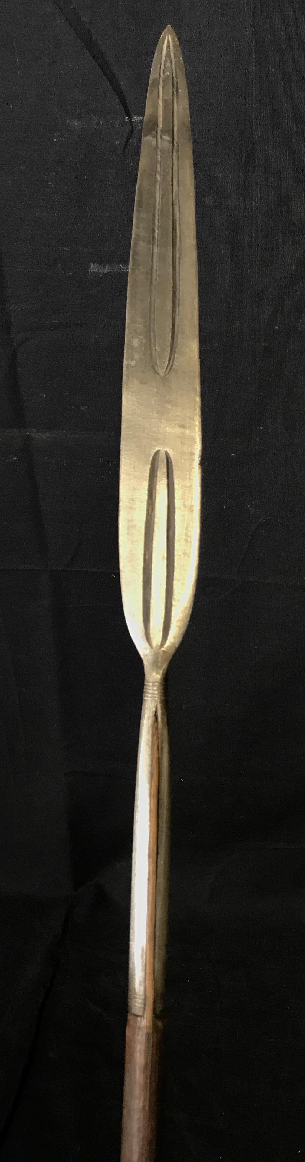 Antique Medieval Style Javelin: Antique Medieval style javelin, shaft of made of a dark wood, shaft has glue of some sort stuck to it, iron headed leaf blade with fluted carvings on either side, A metal cap at the butt end of the sh