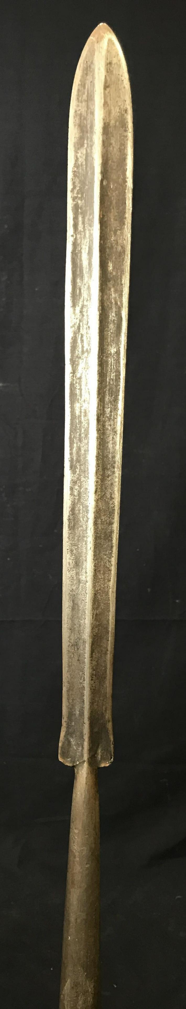Antique Medieval Style Javelin: Antique Medieval style javelin, possibly Celtic, shaft of made of an amber colored wood, iron headed leaf blade with ridged fuller, metal cap at the butt end of the shaft to protect it from damage by 