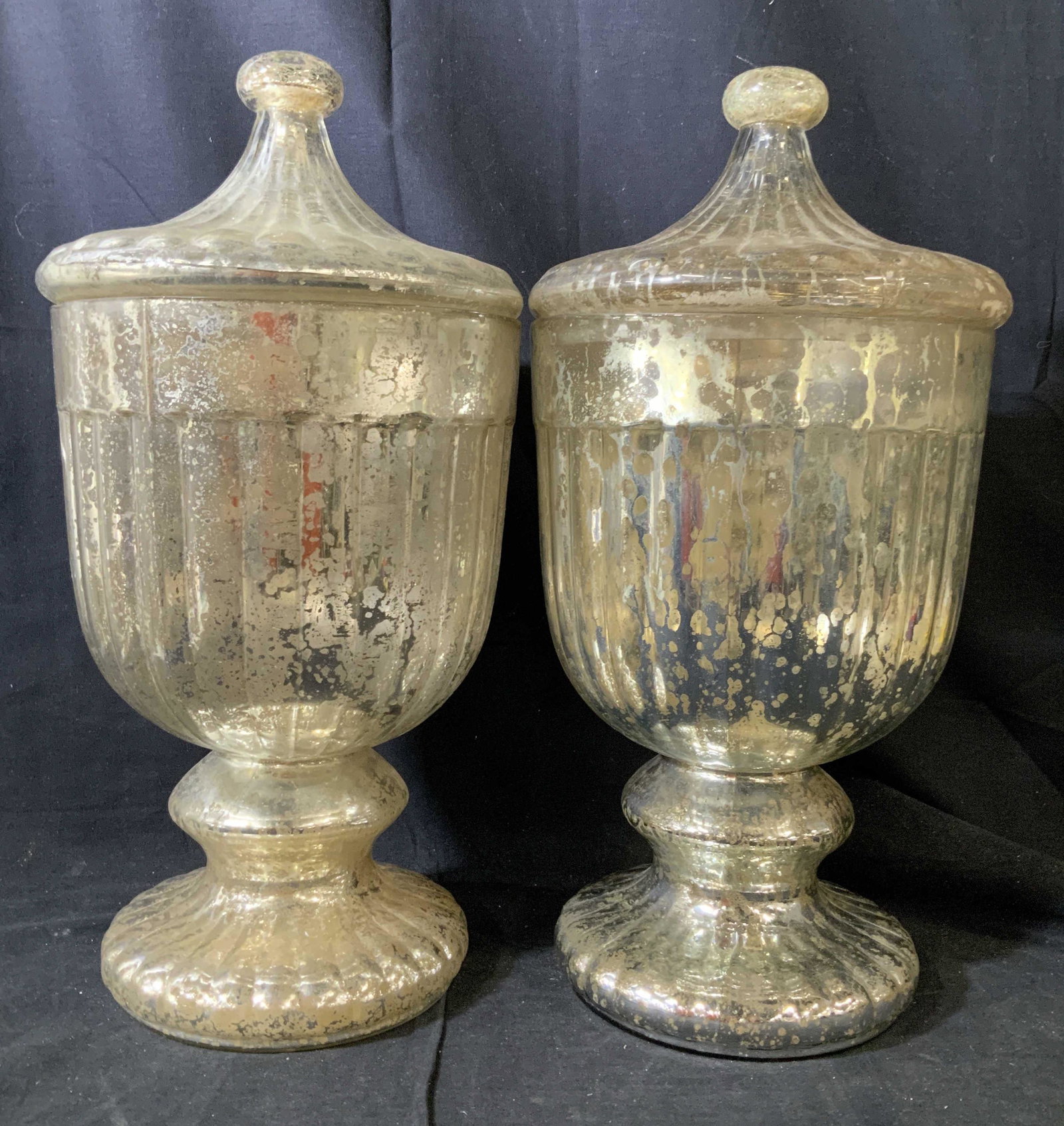 Pair Twos Company Large Mercury Glass Lidded Urns: Pair Urns, vessels, decorative objects, decorative accessories, Mercury glass style with gold and silver crackle style glass, decorative arts, home decor, each has fluted pedestal base, bulbous center