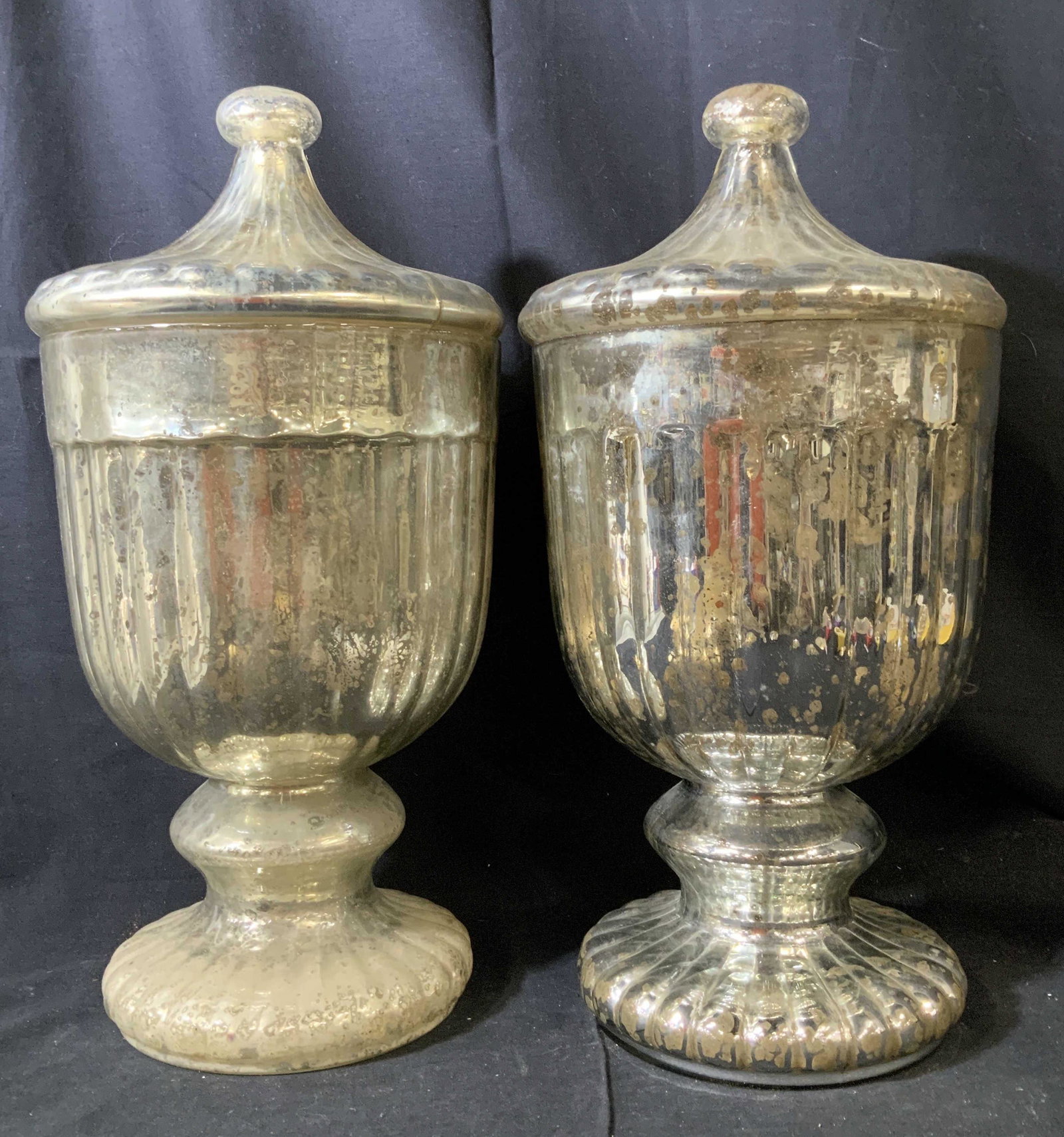 Pair Twos Company Large Mercury Glass Lidded Urns: Pair Urns, vessels, decorative objects, decorative accessories, Mercury glass style with gold and silver crackle style glass, decorative arts, home decor, each has fluted pedestal base, bulbous center