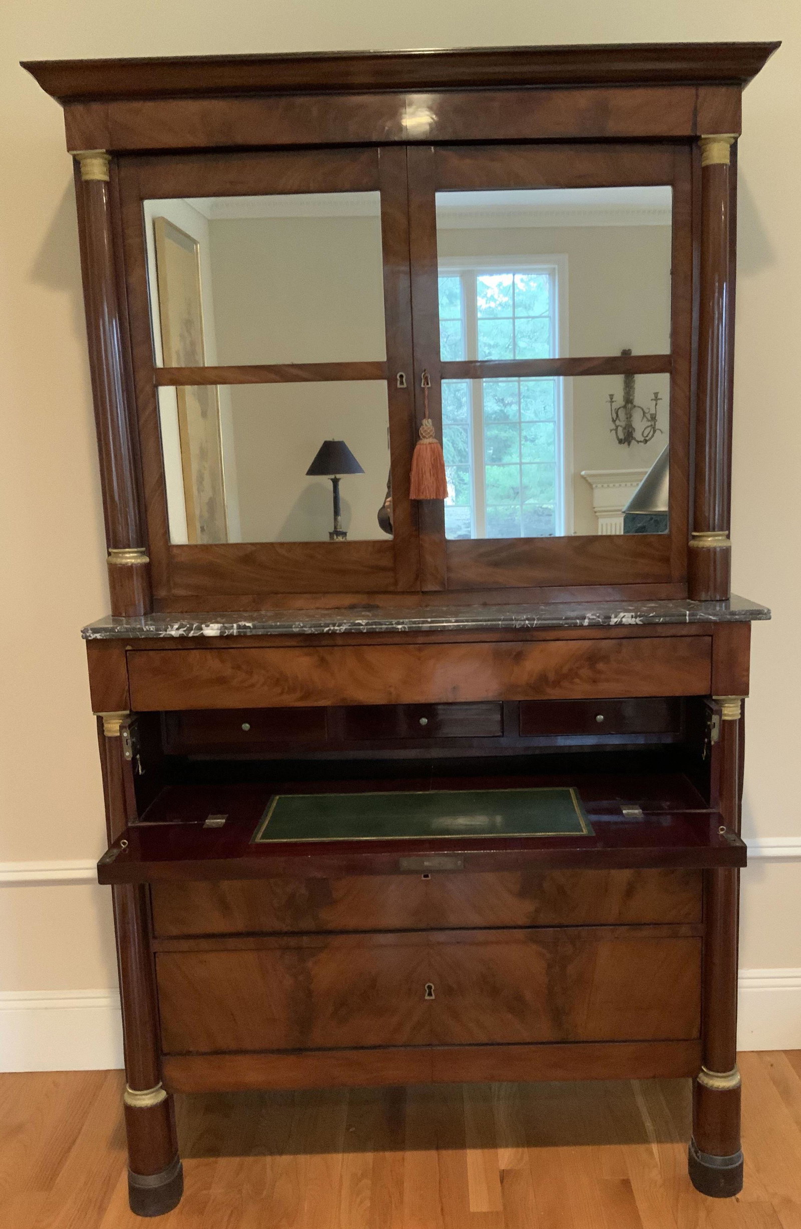 Antique French Napoleonic Secretary Desk: With mirrored cabinet top, 19th century French Napoleon style secretary desk, with mirrored bookcase top. Fold out desk w fitted interior and green leather writing surface, two large lower drawers for