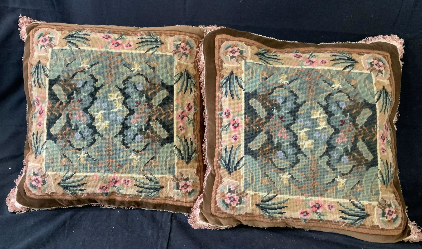 Pair Vintage Needle Point Velvet Toss Pillows: Throw pillows, toss pillows, decorative accessories, each in tones of pink green brown, border of brown velvet, pink fringe, each hand made each measures app 15 by 17 inches