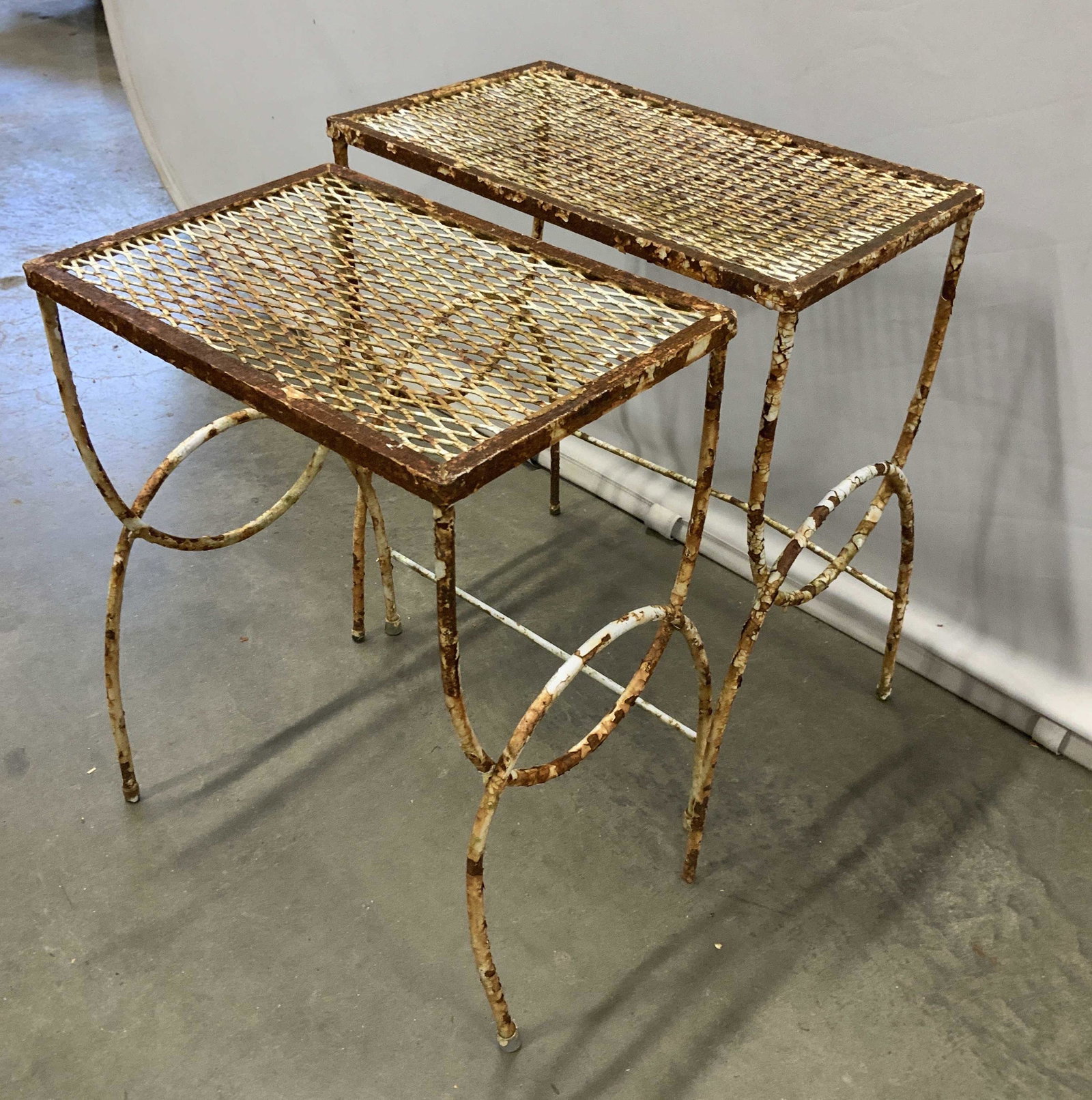 Pair Vintage Iron Nesting tables: Out door furniture, garden furniture, lattice tops and scrolled sides, taller measures 20 inches, top 17 by 10 inches, painted white, significant rust