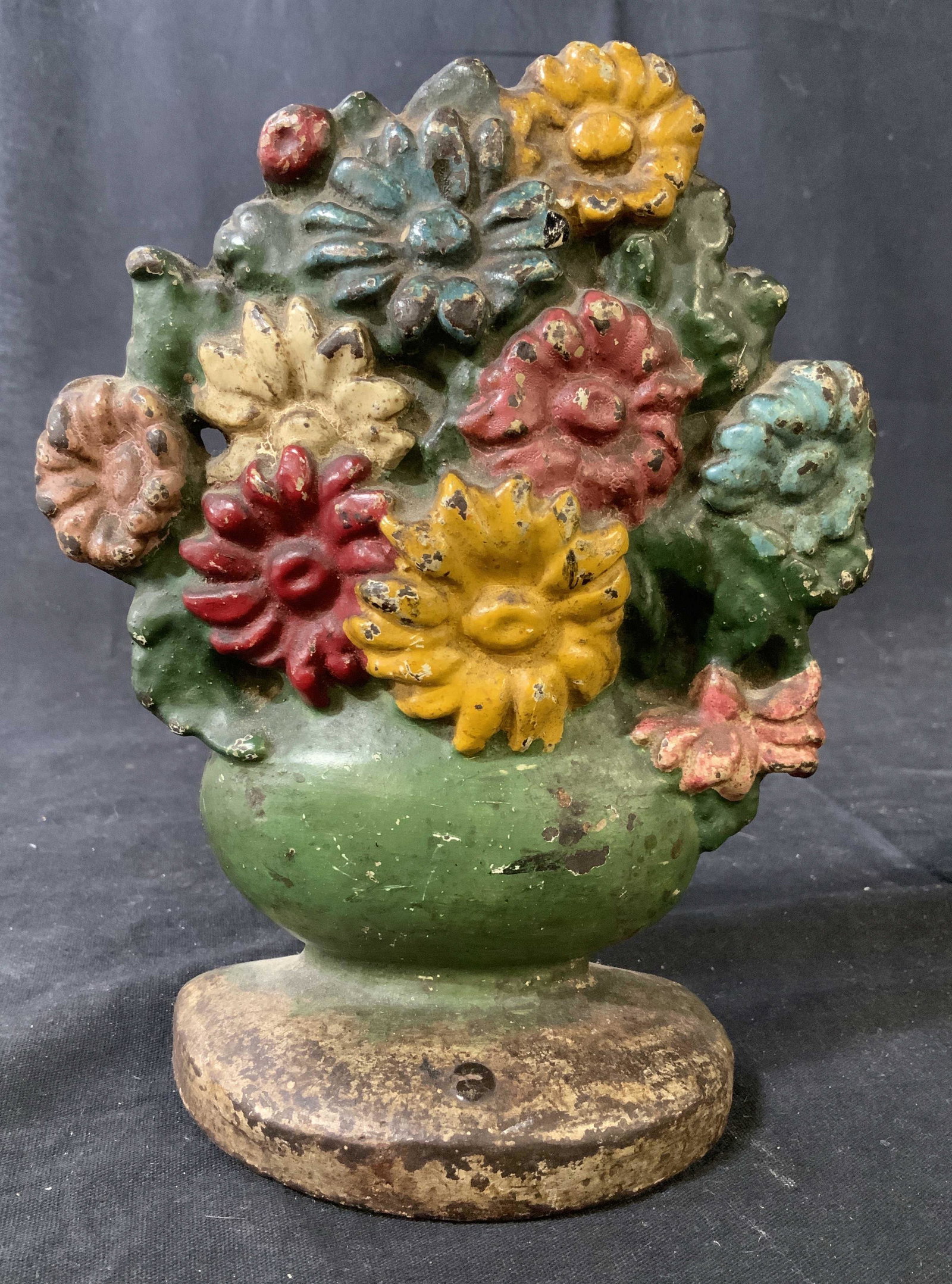 Antique Cast Iron Door Stop: Flower arrangement in basket vase, with original paint, collectible iron door stop, decorative object, measures ht 8 inches width 6 inches