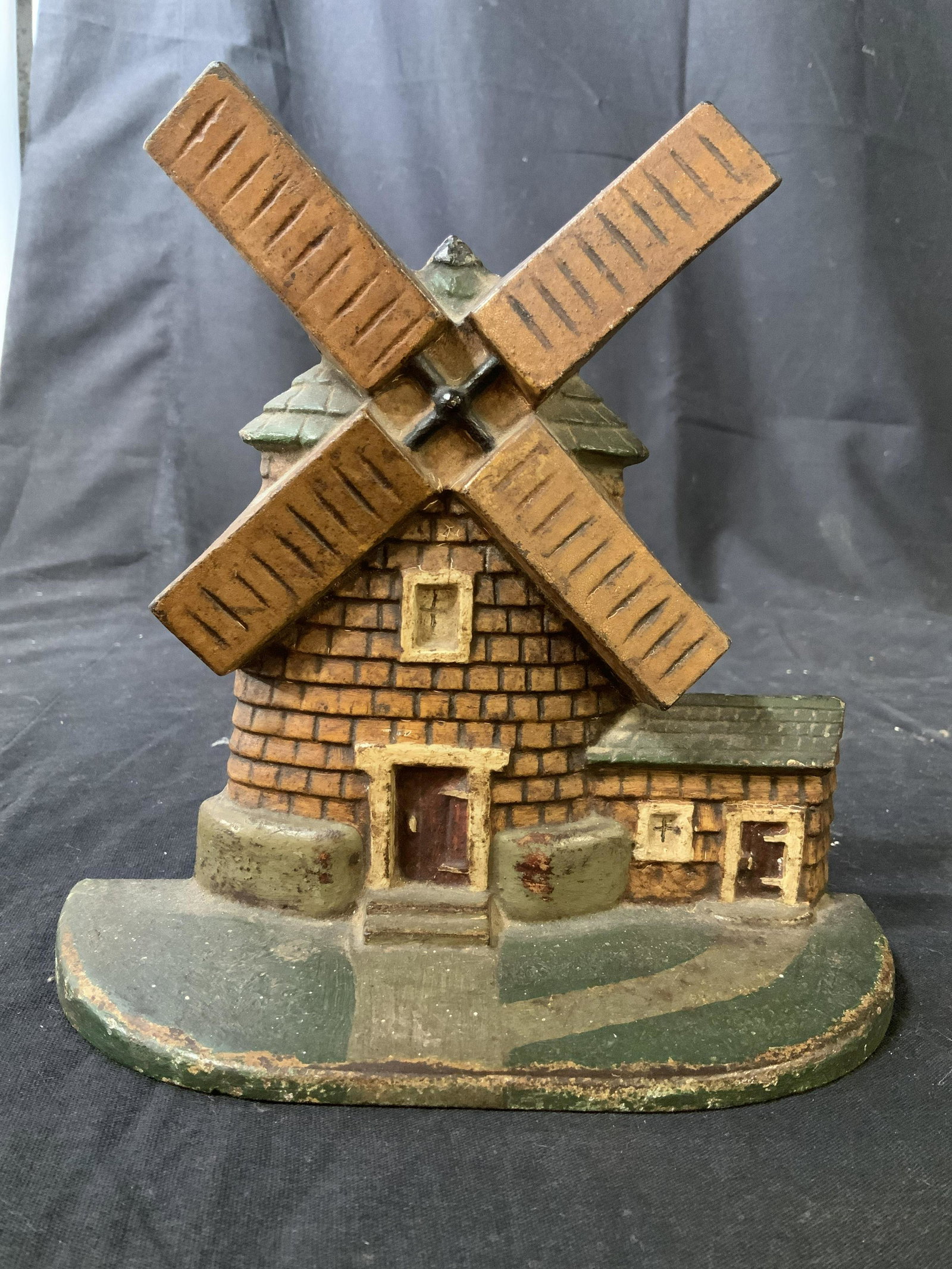 Antique Cast Iron Windmill Doorstop: Antique wind mill door stop, collectible iron door stop, original paint, windmill for, measures ht 7.5 inches width 7 inches, depth 3 inches, marked 10 on verso