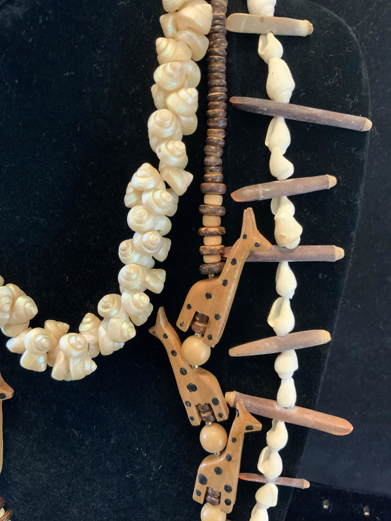 Lot 3 Shell and Wood Carved Necklaces: Longest drop measures app 14 inches, one necklace inter twining mini pearlized snail shells, one shells and wood beads and one has carved giraffes with wood beads, organic necklaces, tribal style, Afr