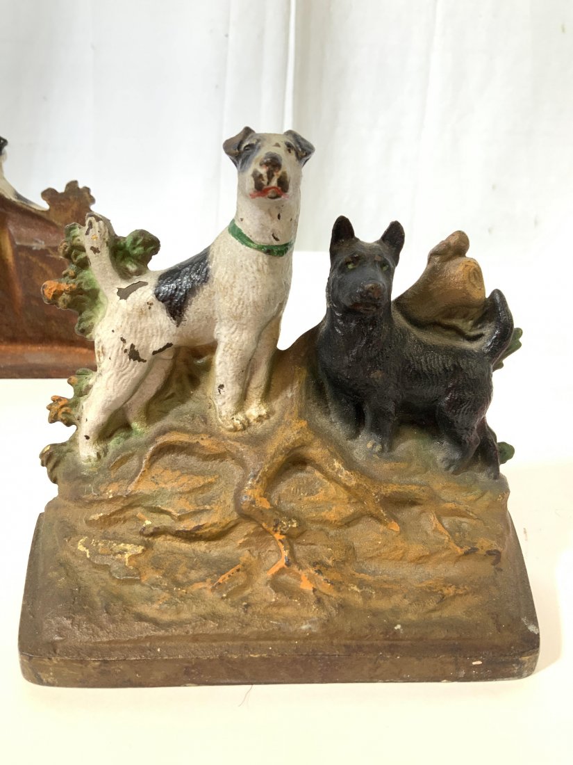 Pair Vintage Painted Cast Iron Dog Doorstops: Vintage iron doorstops, each with painted dogs, book ends, decorative objects, collectibles, each measures ht 5 inches width 6 inches depth 3 inches, each has number 268 on back, wear to paint.