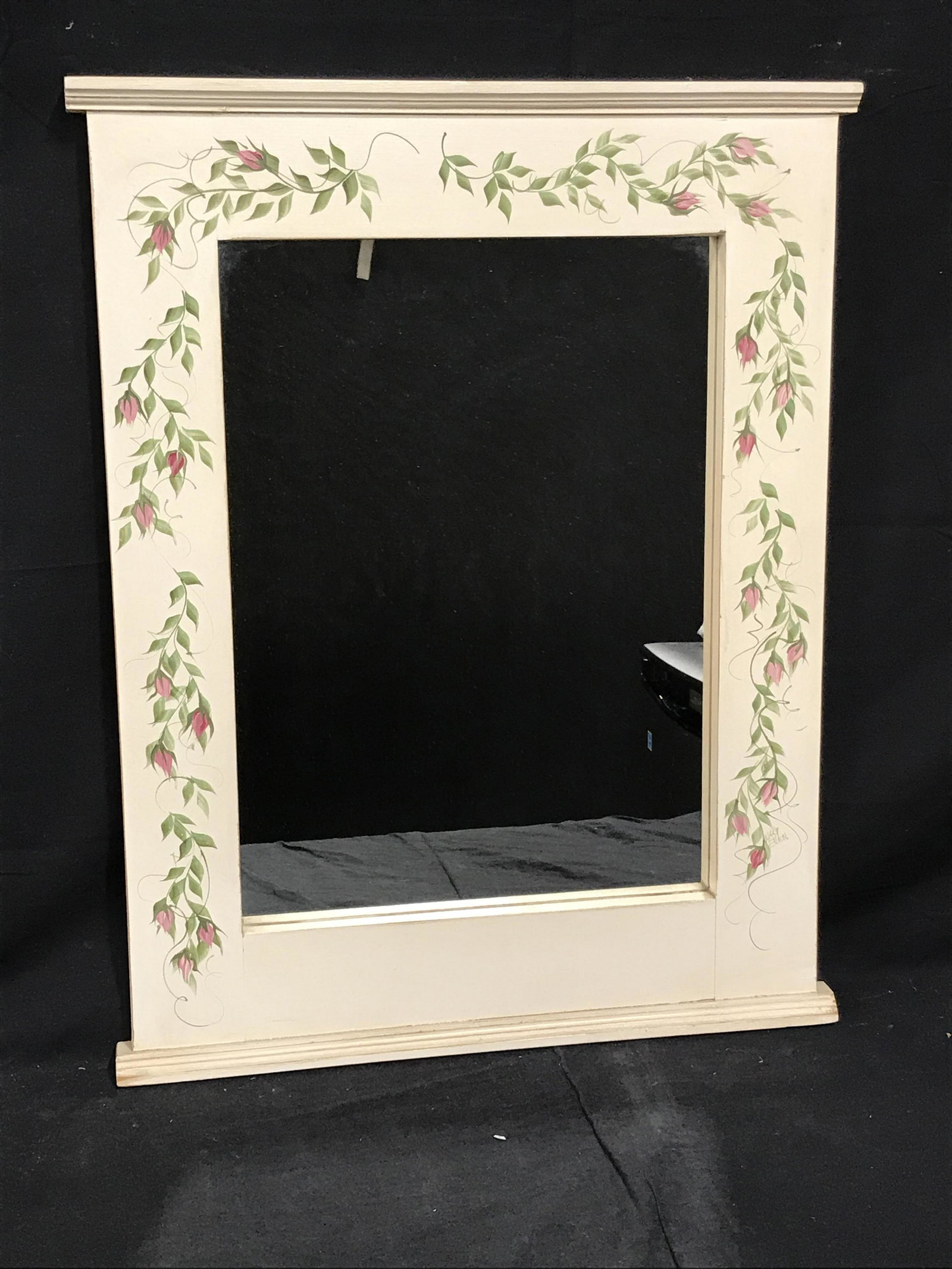 Signed Hand Painted Wooden Mirror: Signed Hand Painted Wooden Mirror, Signature on the lower right border possibly reads ‘Nar Ellen’, painted white with green vines and pink blossoms along the border, mirror in good condition, meas