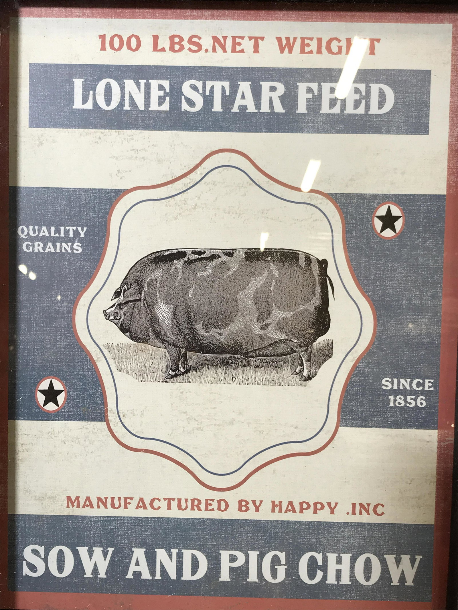 Framed Sow & Pig Chow Advertisement New in Box: Framed Advertisement new in box, ad displays text and a black and white pig on a white and blue striped background stars and red border, text on top center section reads ‘100 Lbs Net Weight Lone Sta