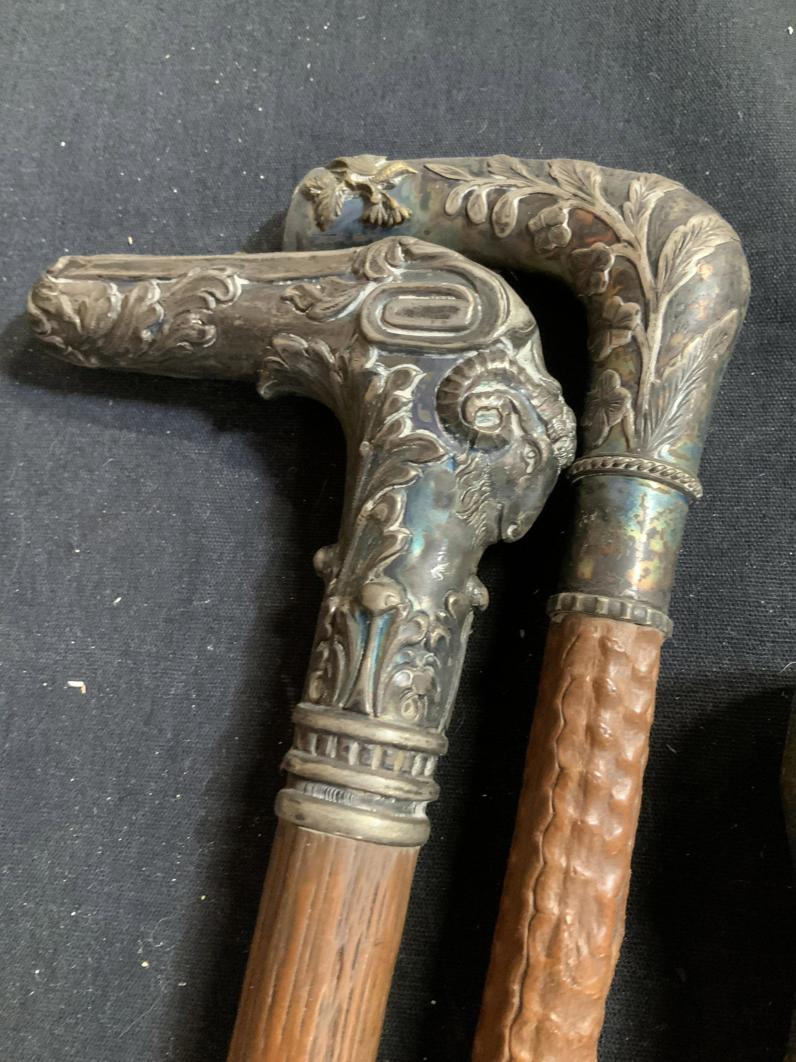 Collection 14 Canes Walking Sticks: Collection of 14 interesting walking sticks, canes with bamboo stand, three walking sticks have sterling silver tops with repoussee design work, brass horse head label for made in England, carved bone