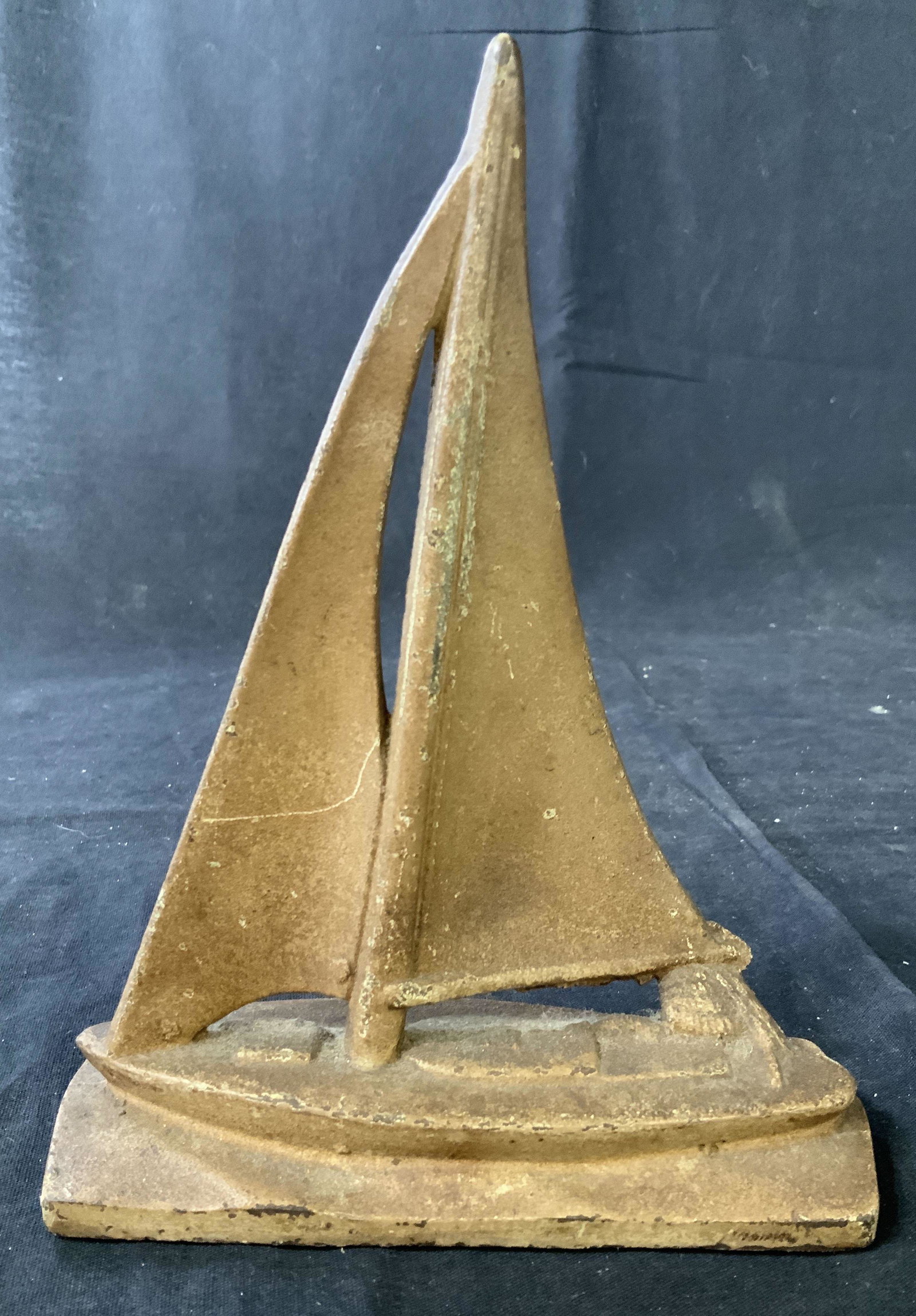 Antique Iron Sailboat Form Door Stop: Collectible cast iron door stop, measures app ht 8.5 inches, width 6 inches, antique collectible, decorative object, maritime collectible, nautical collectible, sea theme