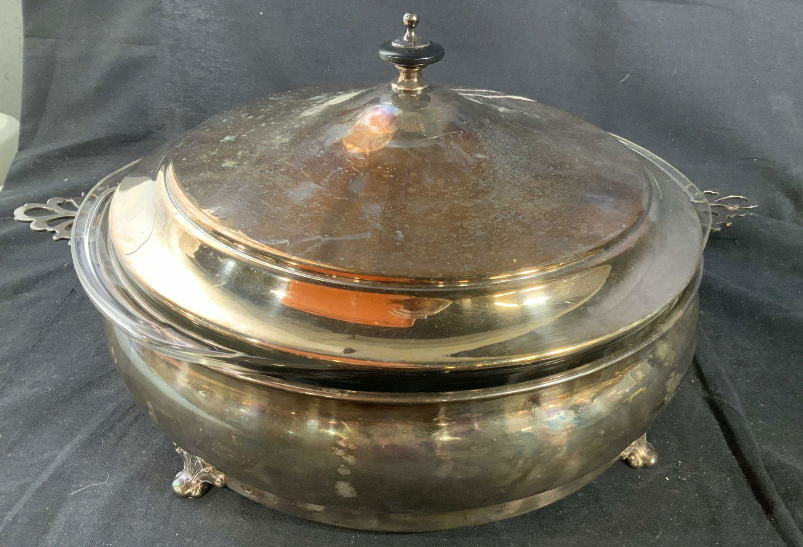 Silver Plate Lidded Buffet Server: With Pyrex glass insert, and footed, open work handles, Finial, silver plate, lidded bowl, server, table ware, measures Ht 8 inches diameter app 14 inches