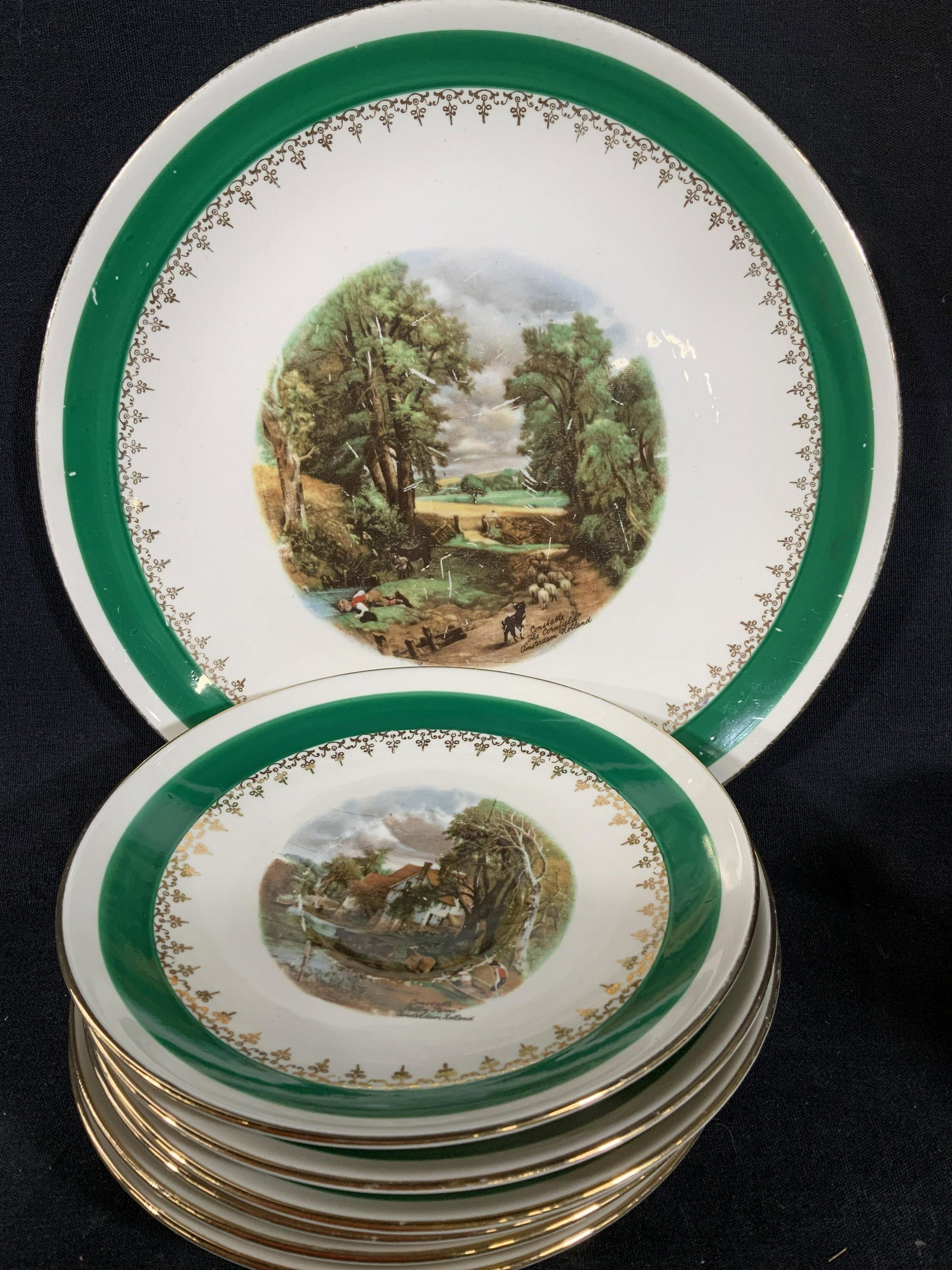 Homer Laughlin Rhythm, partial Coffee Service: Collectible porcelain ceramic table ware, sugar creamer, 4 cups, cake plate diameter 9.5 inches, small bowl, 6 saucers and one small plate, each with farm woodland scene, cows, sheep, Figurals, landsc