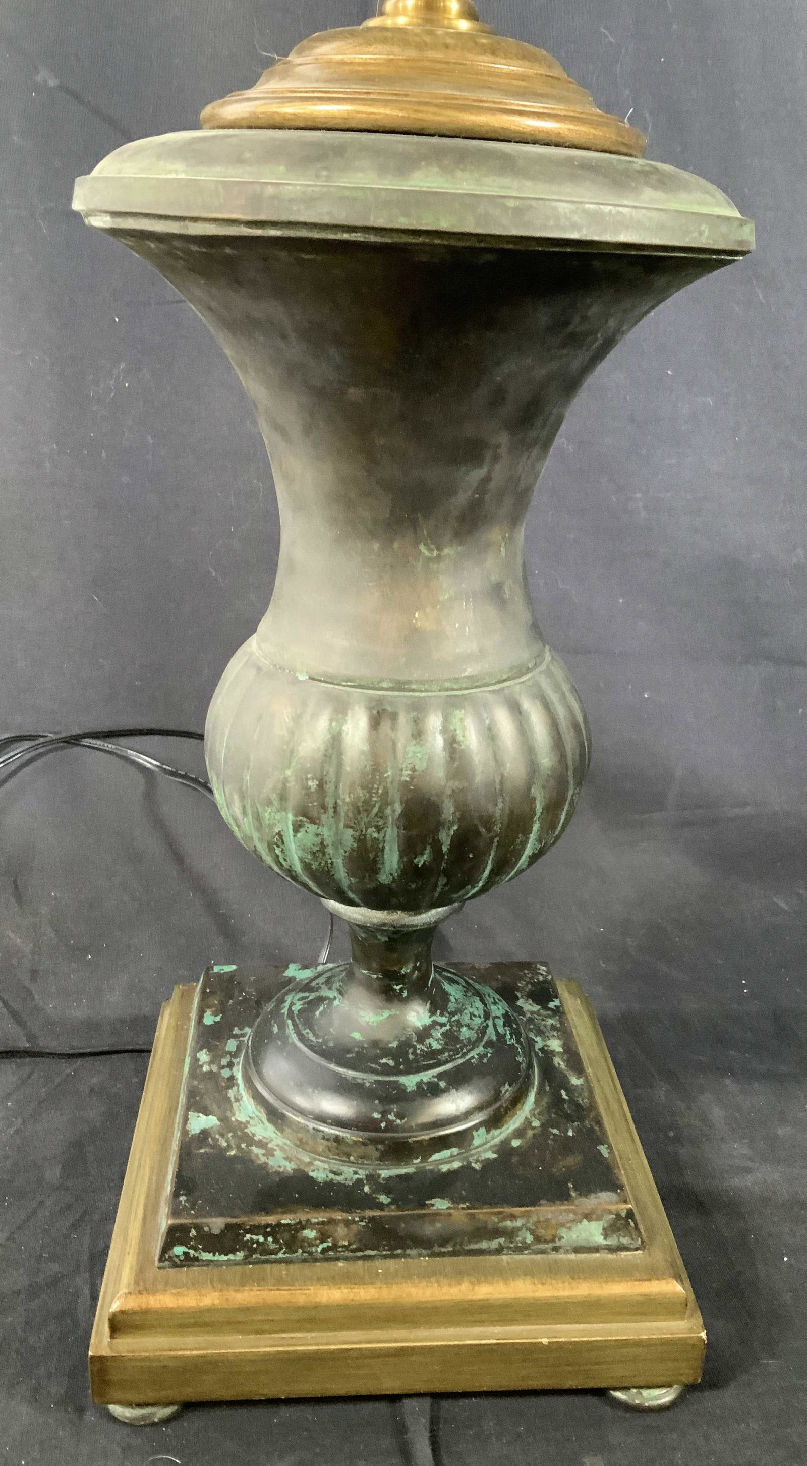 Mixed Metals Black and Brass Lamp: Urn form lamp on pedestal and four pad feet, measures to finial app ht 26 inches, base measures app 7 inches square, metal lamp, lighting, table lamp, home accent, decorative accessory, piece has weig