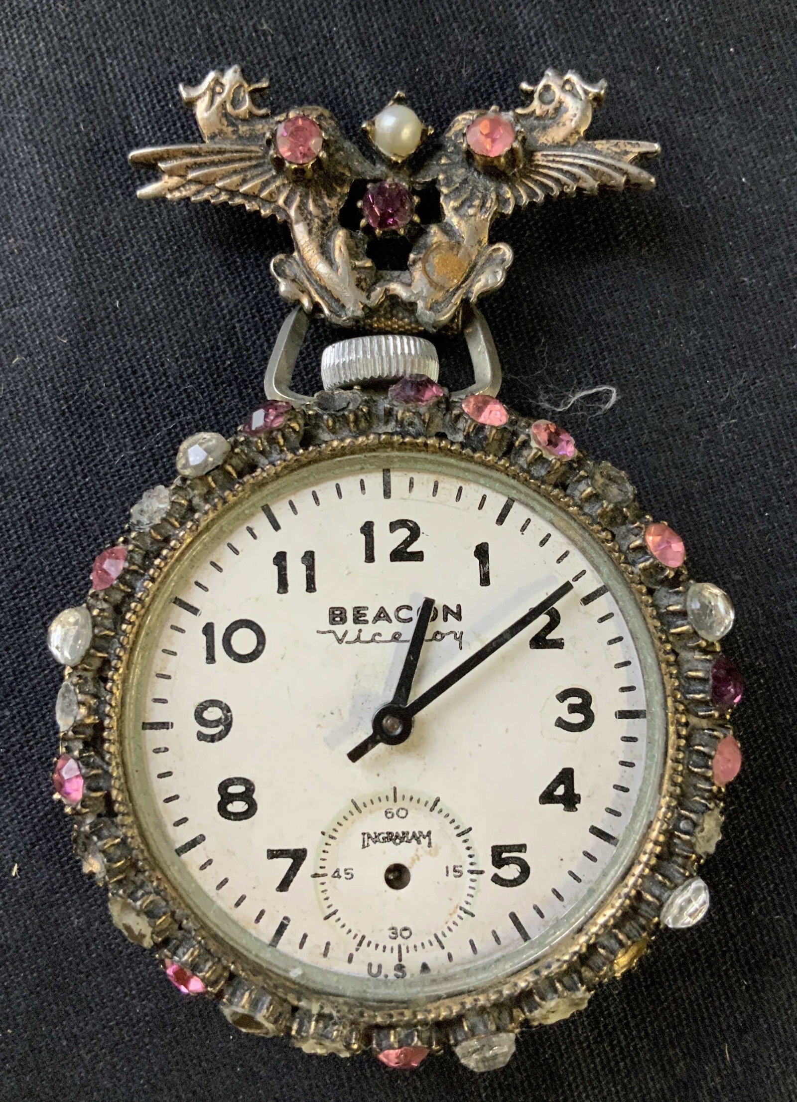 Beacon Vicerory, Rhinestone Metal Pocket Watch: Vintage possibly antique, lower portion reads Ingraham on face, upper reads Beacon Viceroy, attached is decorative fastener rhinestones pearls and silver toned griffins, decorative object, pocket watc