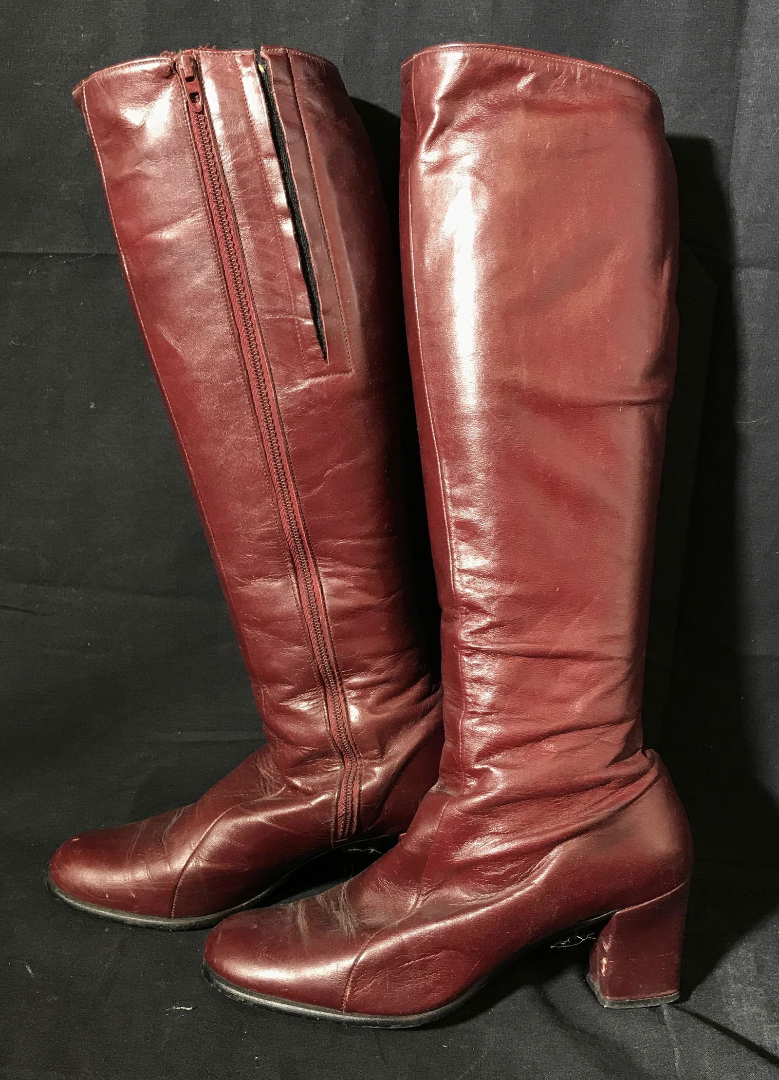 Golo Burgundy Leather Heeled Knee High Boots: Golo burgundy leather heeled knee high boots, size 7, tag on inside of boot reads ‘Golo, 7M, 0753242230, Leather upper; balance man-made’, heel measures 2.5 inches tall, boot measures 17.5 inches