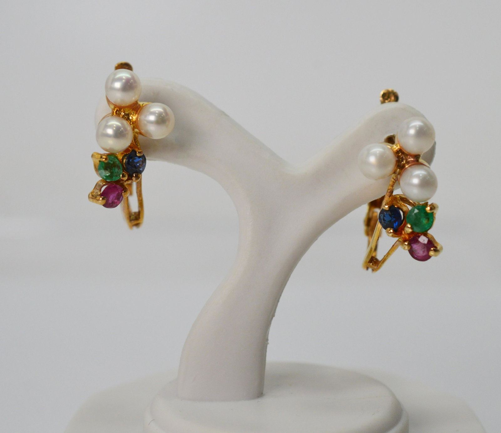 Retro Sapphire Emerald Ruby Pearl Cluster Earrings: Retro Sapphire, Emerald Ruby Pearl Cluster Hoop Earrings. 7/8 inch length. Retro Style 14 karat yellow gold hoop earrings with jewel cluster accent of emerald, ruby, sapphire & pearl. For pieced ears,