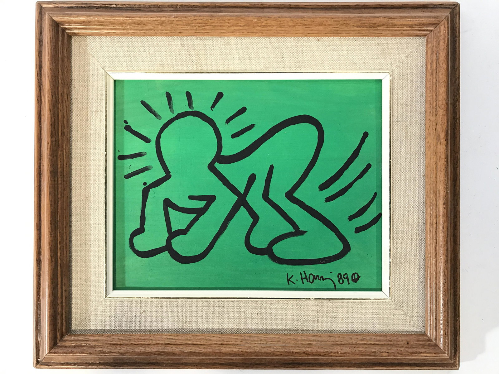 Signed Framed Painting On Board Attr KEITH HARING: Painting of person on hands and feet. Appears to be signed K. HARING 890. Painting is professionally framed. With wooden frame. Frame measures approximately 15.25 inches long 13 inches tall. Artwork m