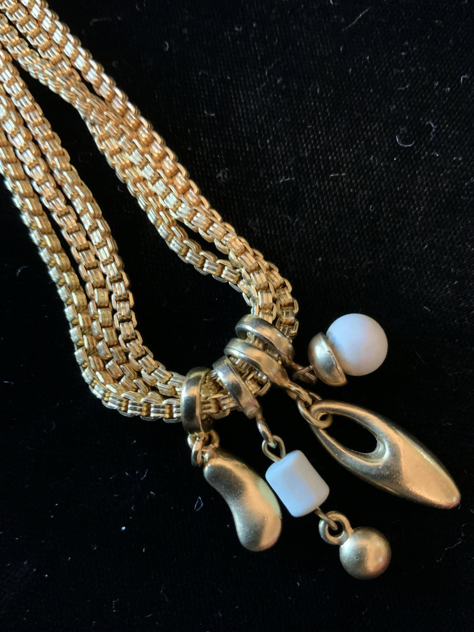 Vintage Multi Strand Gold toned Necklace: Costume jewelry, in the bright polished style of 22K gold, vintage jewelry, estate jewelry, triple strand box link chain necklace with four dangling pendants, drop app 8.5 inches, with adjustable leng