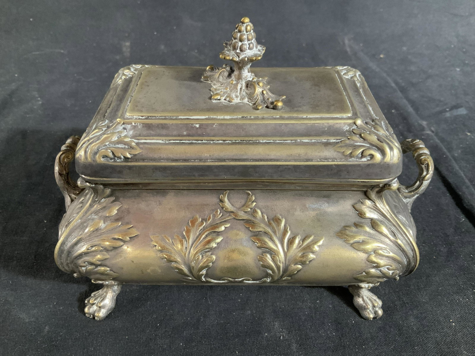 Antique NORBLIN WARSZAWA Silver Tnd Footed Box: Antique Box silver toned Art Nouveau Style Box, marked underside for NORBLIN and Co, also marked WARSZAWA, some writing illegible, also numbered 1323, also marked HH, and trademarked with winged swan 