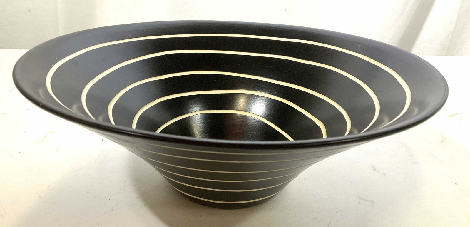 Signed Black White Swirl Centerpiece Bowl: Signed underside may read K Z, porcelain ceramic bowl black underglaze with white swirl pattern, centerpiece bowl, decorative accessory, hand crafted porcelain ceramics, table ware, measures ht 5 inch