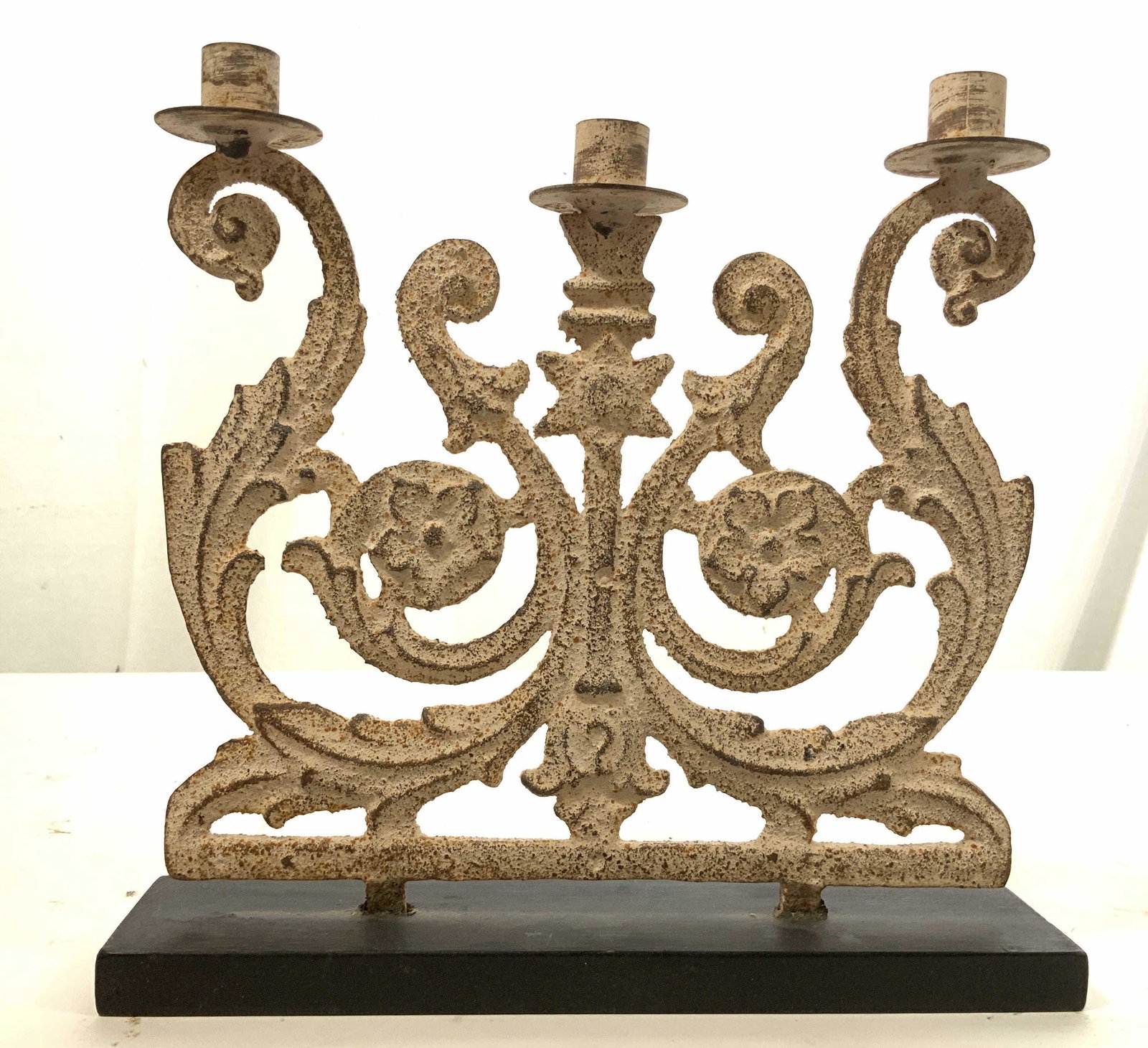 Painted Iron on Wood Candelabra, Sculpture: Three candle holders with scrolled iron work and six pointed center star, possibly Judaica, possibly Israeli decorative arts, mounted in Wood base, measures ht 12 inches, width 12 inches depth 3 inche