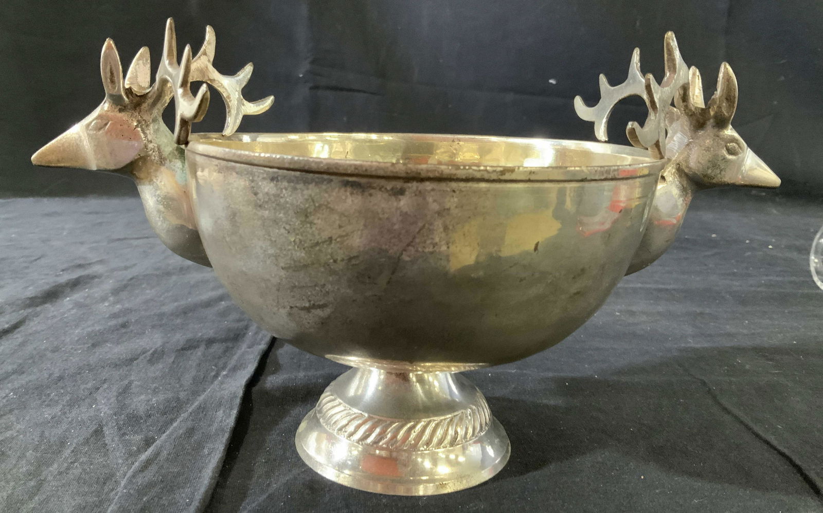 Silver Plate Deer Head Pedestal Bowl: Silver plate pedestal bowl with Antlered deer head Mounts as adornment, table ware, tazza, candy dish, nut bowl, tableware, decorative object height 6 inches diameter 11 inches. Discoloration to metal