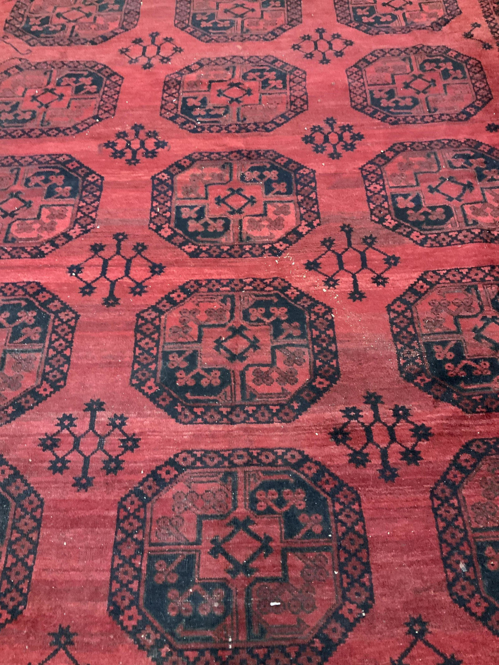 Room Size Wool Oriental Wool Carpet: Has label but illegible, possibly partially reads Afghanistan, hand made room size wool carpet, Area rug, carpet, vintage oriental carpet, deep red , navy black tones geometric measures 127 by 107 inc