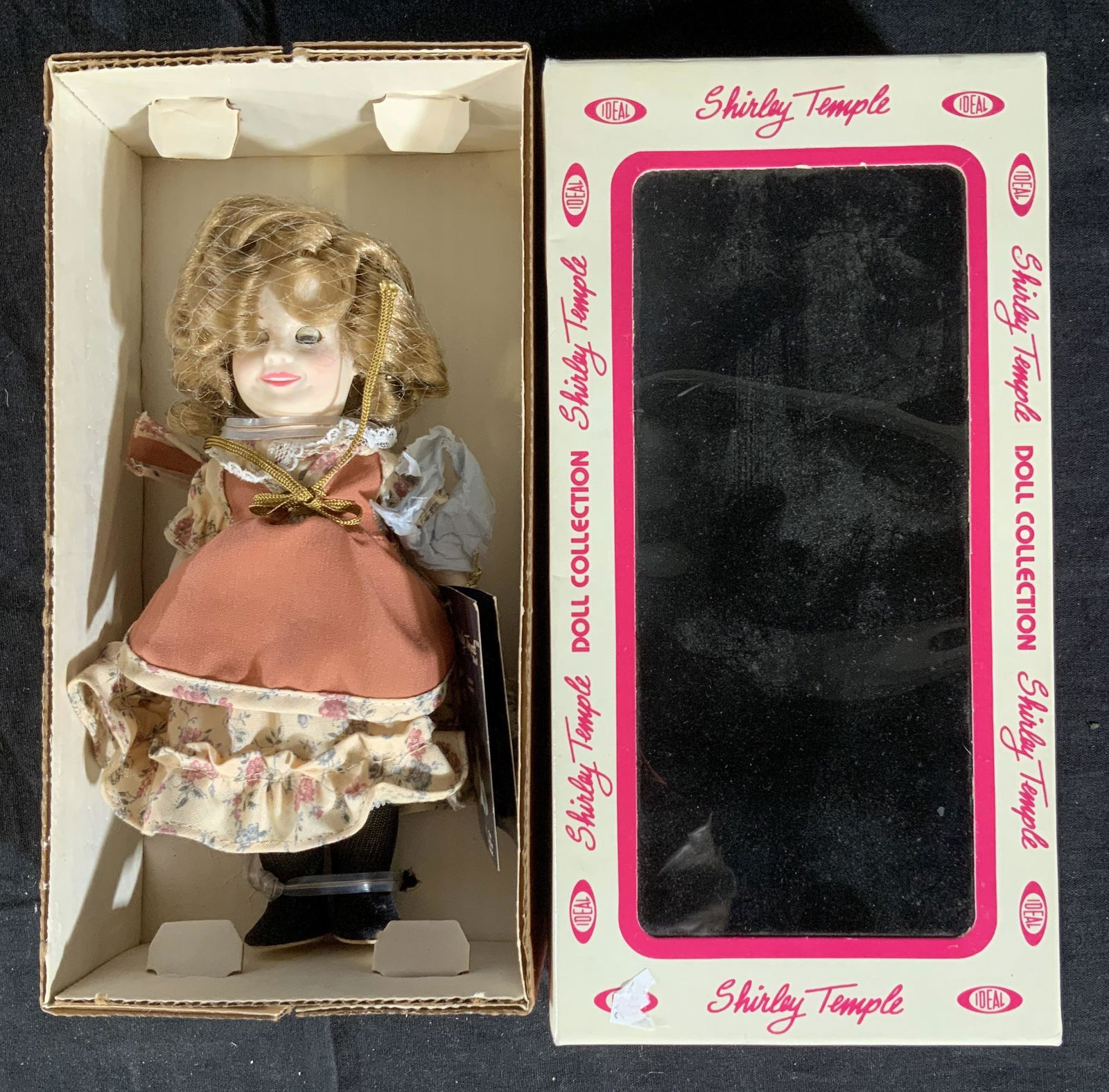 Collectible Shirley Temple Doll in Box: Vintage Ideal Toy Company Shirley Temple Doll, in original pink and white box with cellophane window, side of box reads Shirley temple doll collection, Ideal Toy Corporation 1982, Newark, No, made in