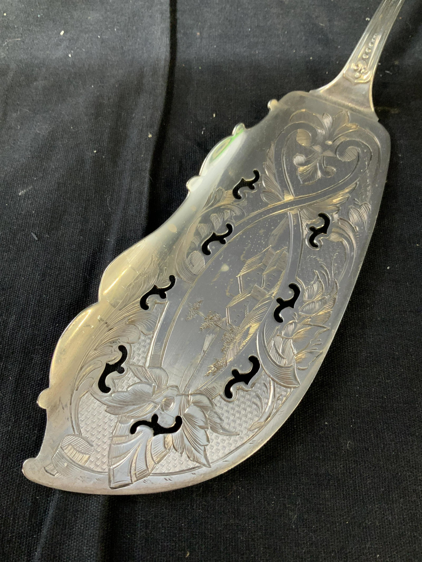 Vintage Sterling Silver Specialty ServerFlatware: Sterling silver hostess servers flatware, fish server, etched chased and repossess design of flowers, scrolls, and farm on lake scene as medallion, measures length 12 inches width 3 inches,weight 3.63