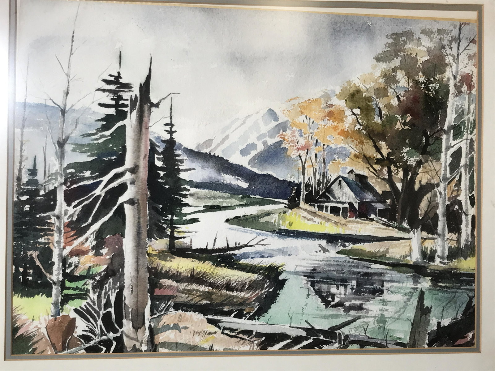 Watercolor on Canvas Paper Landscape: Watercolor on canvas paper, no apparent signature, subject a mountainous woodsy landscape with a river running through it as well as a cabin by the edge of one of the river bends, double matting in bl