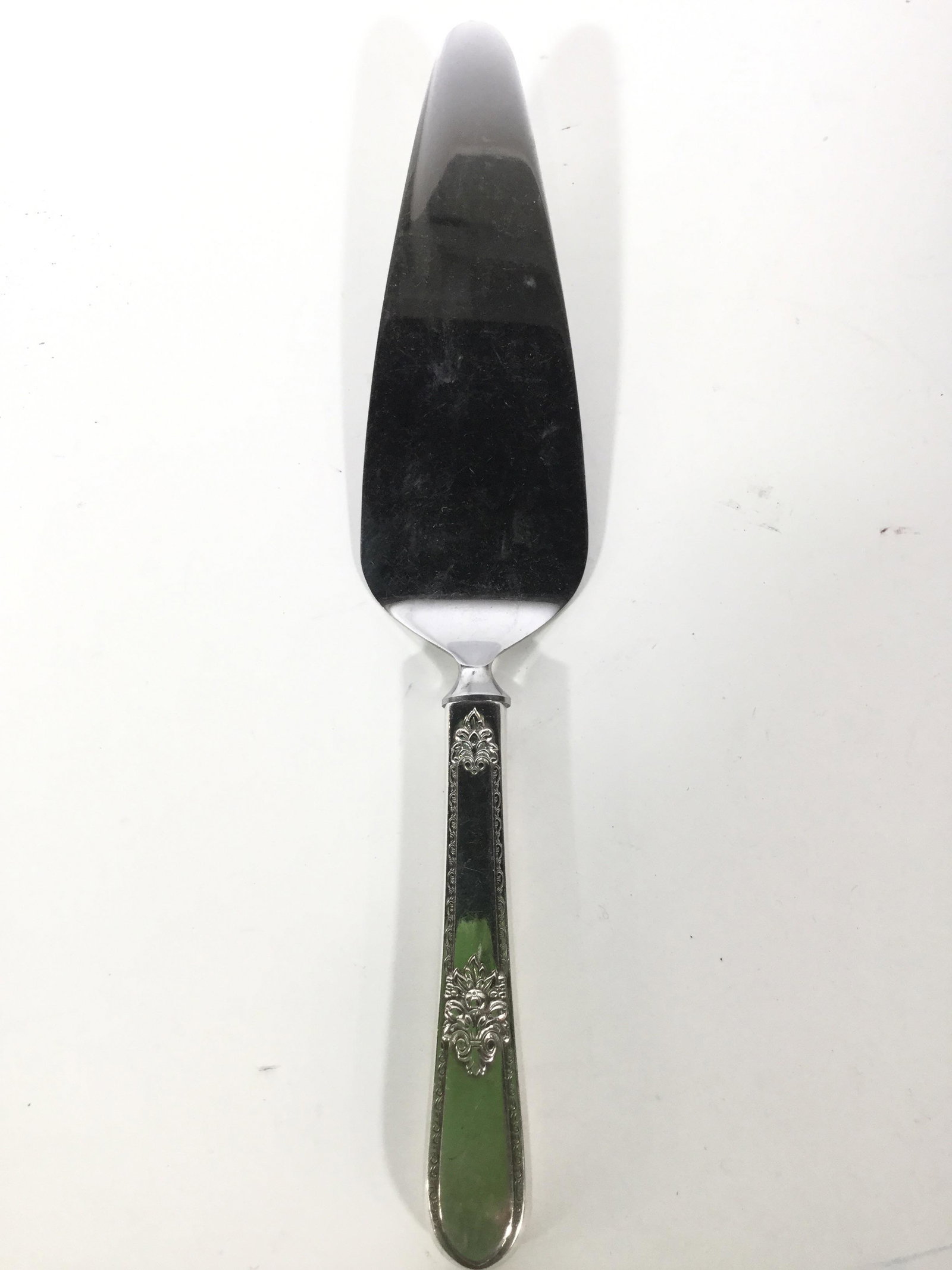 Vintage Silver Toned Metal Pie Server: Pie server is silver toned and metal. Handle of pie server is possibly sterling silver. Blade reads STAINLESS. Pie server, hostessware, table wear, utensils, pie knife, silverware, vintage silverware,
