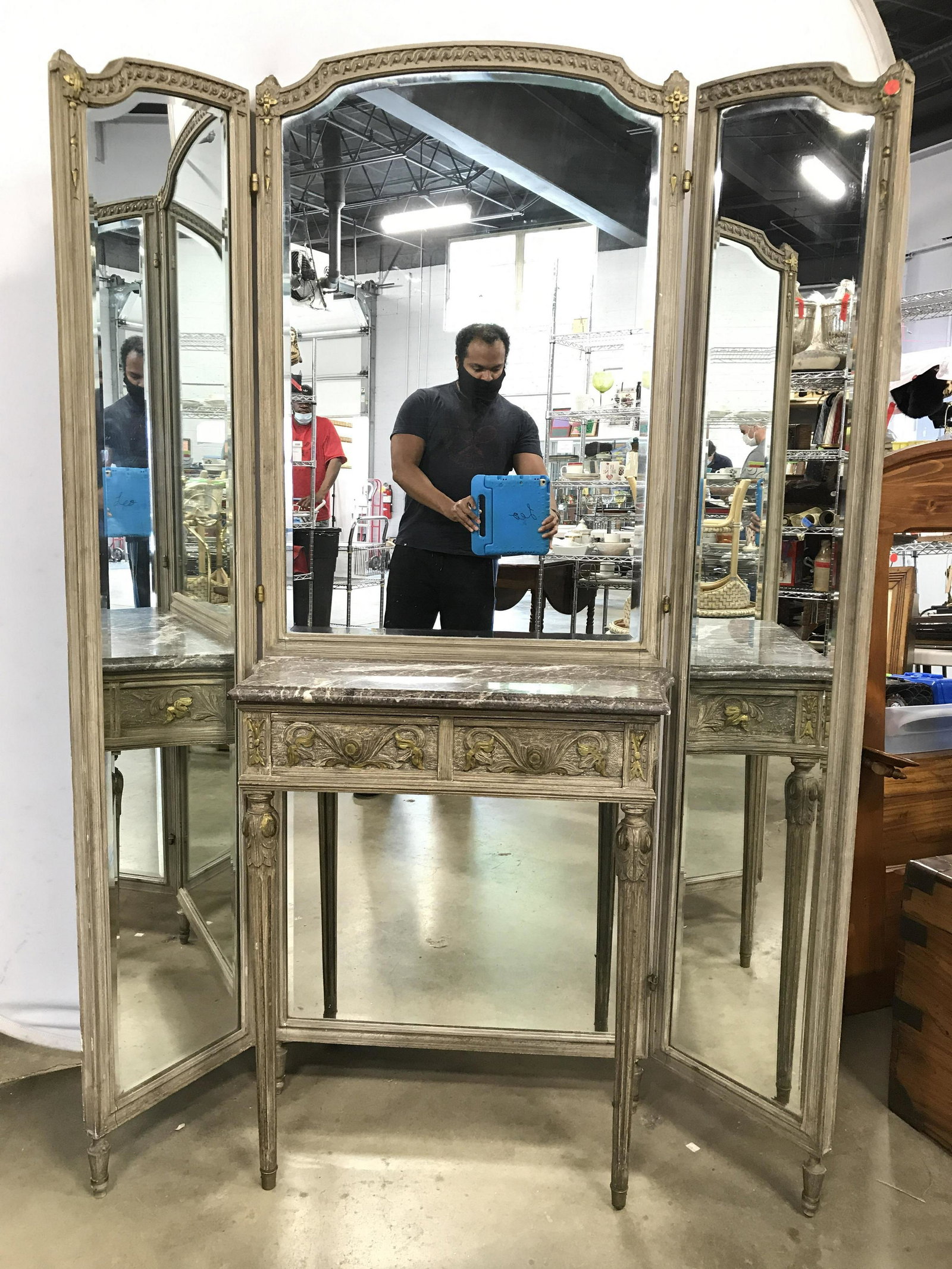 Antique Folding Wooden Mirrored Dressing Table: Dressing table has marble top which sits on 2 drawers with carved ornate detail. Drawers have hand dovetailing. Piece has beveled mirrored surfaces. Measures approximately 73 inches tall 12 inches dee