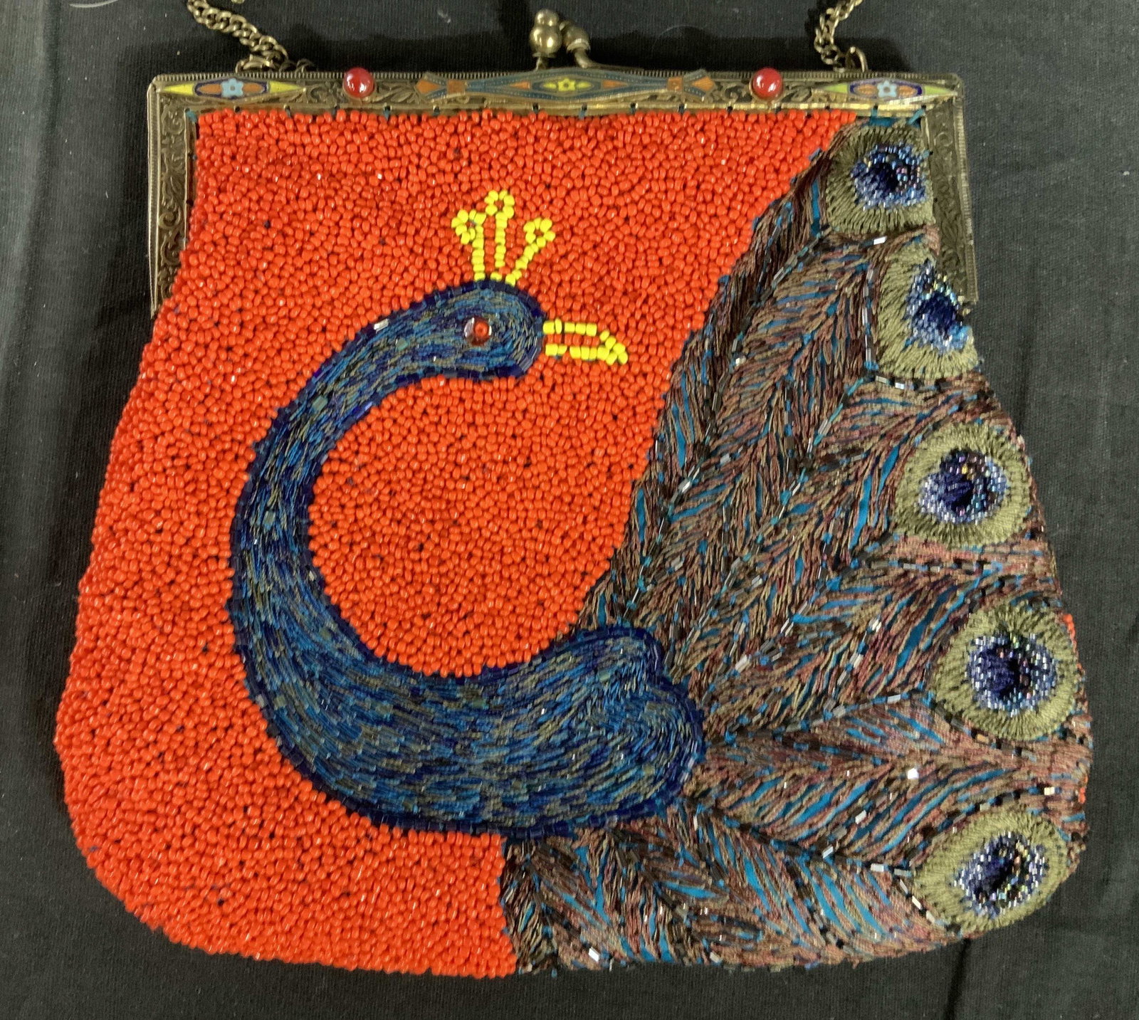 CHRISTIANA Peacock Design Beaded Handbag: Vintage Christiana micro beaded hand back, multi colored, bright orange back ground with gem toned blues purples colorful peacock design, etched gold toned metal frame with accent beads, label inside 