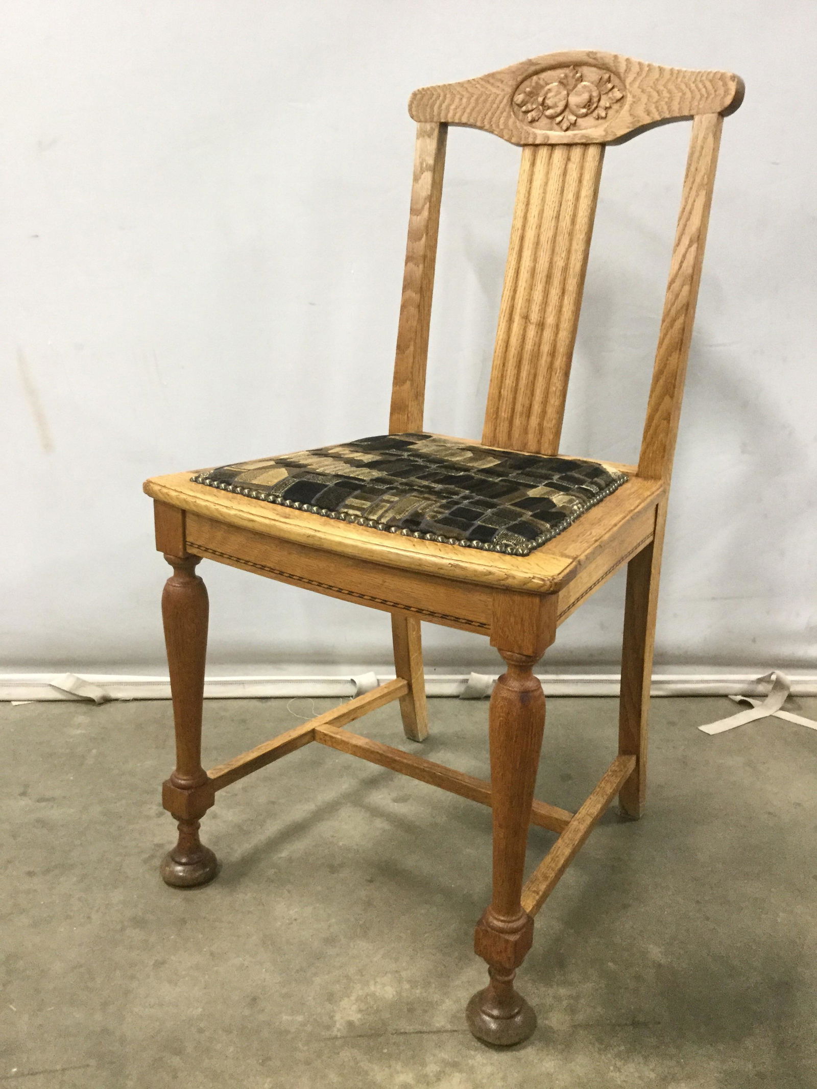 Set 4 Antique Belgian Oak Dining Chairs C 1920: Lot includes 4 chairs. Each chair and is wooden & antique. Chairs appear to be Oak. Top of each backrest has carved floral & leaf detail. Each chair has Upholstered Seat with nailhead detail at edges.