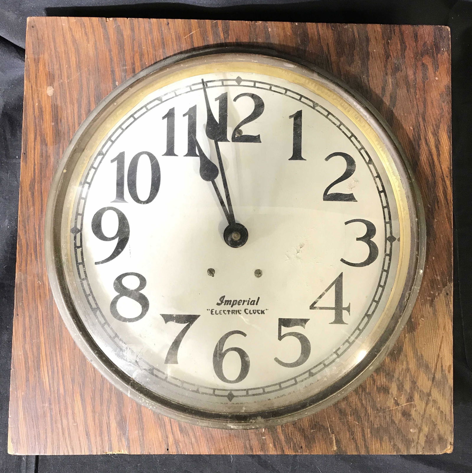 Vintage Wood Cased Imperial Electric Clock, USA: Hook for wall mount , cover of wood case has hint opening, brass and glass on face, wood case measures 15 inches square, depth 4 inches large oversized numbers, collectible clock, face reads imperial