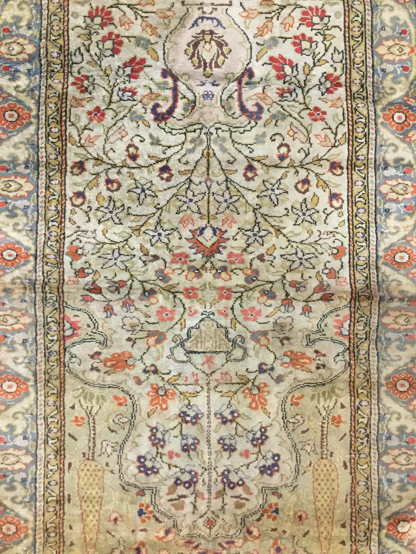 Antique Handmade Wool Turkish Prayer Rug: Rug is wool and handmade. Rug is antique. Piece has fringes. Rug contains multi toned floral vine and leaf detail. Rug is Turkish. Rug, carpet, area rug, area carpet, Prayer rug, wool rug, handmade ru