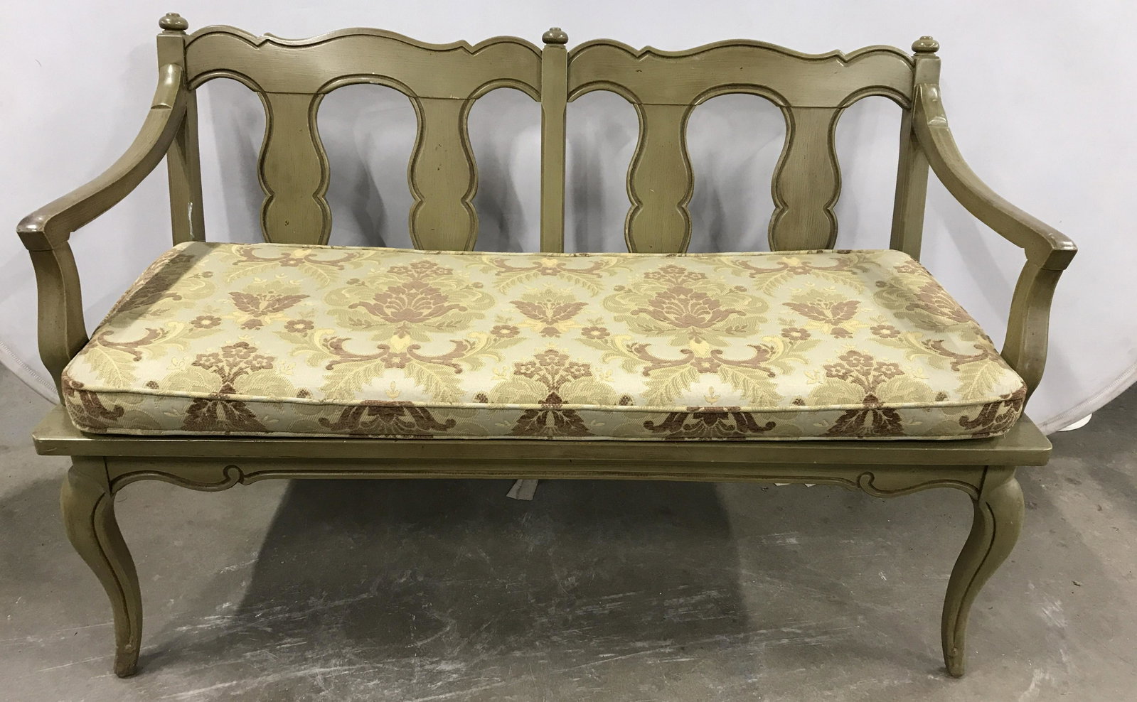 Antique Slat-back Bench W Upholstered Cushion: This piece measures approx 31 inches H, 47 inches W, and 18.5 inches deep. The bench is olive toned, the cushion is single welt and removable. The front legs are cabriole. The wear present is consiste