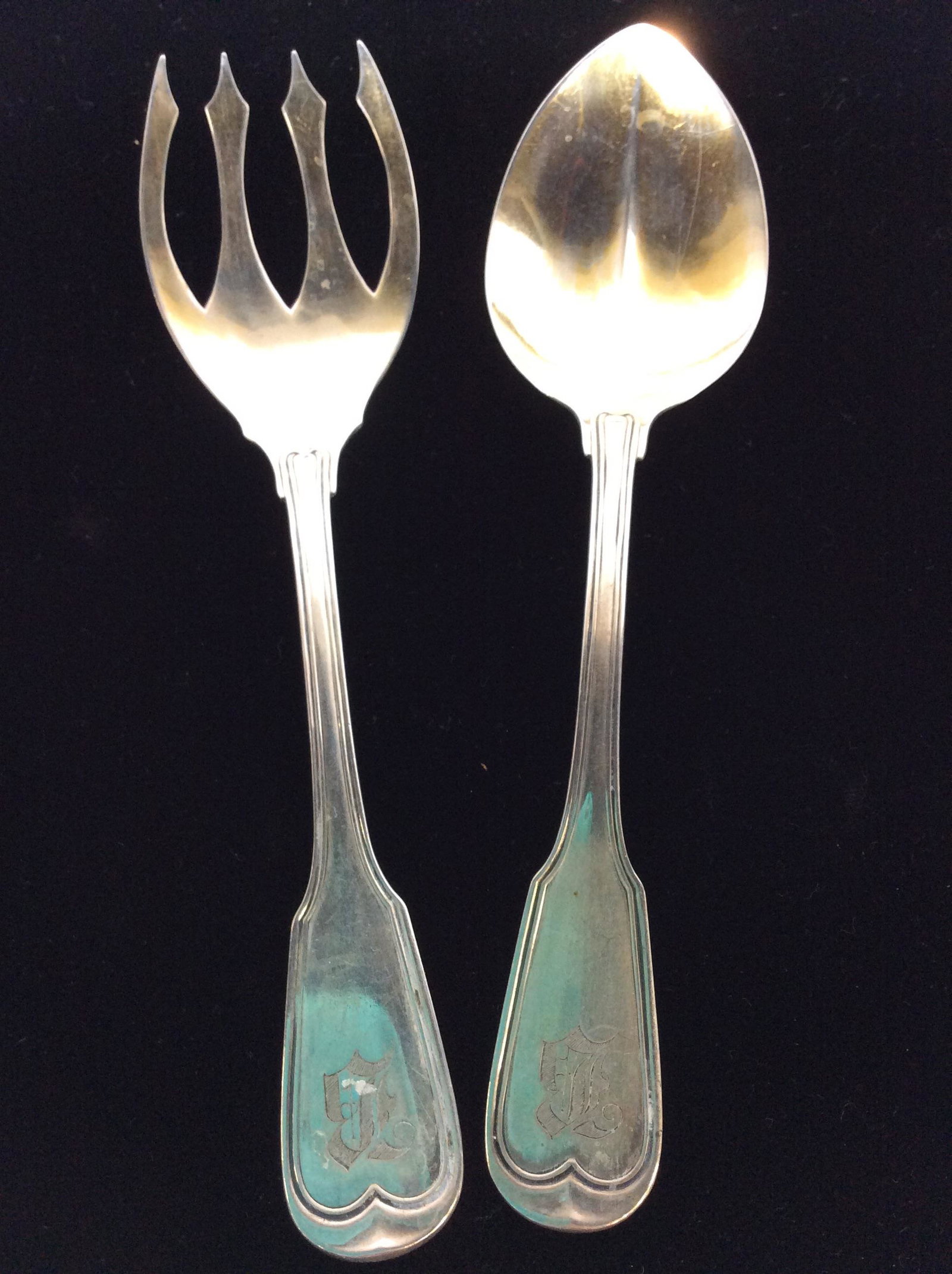 Sterling Silver Serving Fork & Spoon, 2 pcs: Both pieces labeled 800. Possibly reads OSTERBERG or possibly OSTERBERY ( some letters illegible). Both are 8.5 in Length, Fork 1.85 ozt Spoon 1.84 ozt Both Handles Monogrammed. Serverware, Serving Fo