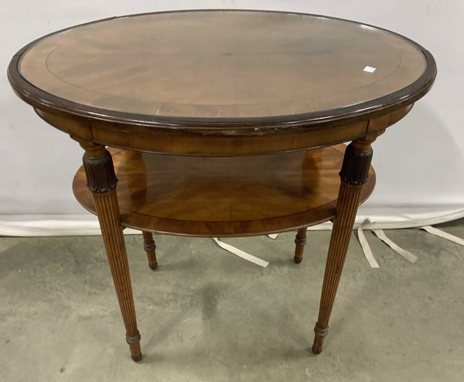 Antique Inlaid Banded Oval Table: Oval occasional table, side table, end table, tea table, oval top with banding, apron and center inlay, reeled tapered legs, lower oval shelf with wide inlaid banding, measures app 29 inches ht, top 3