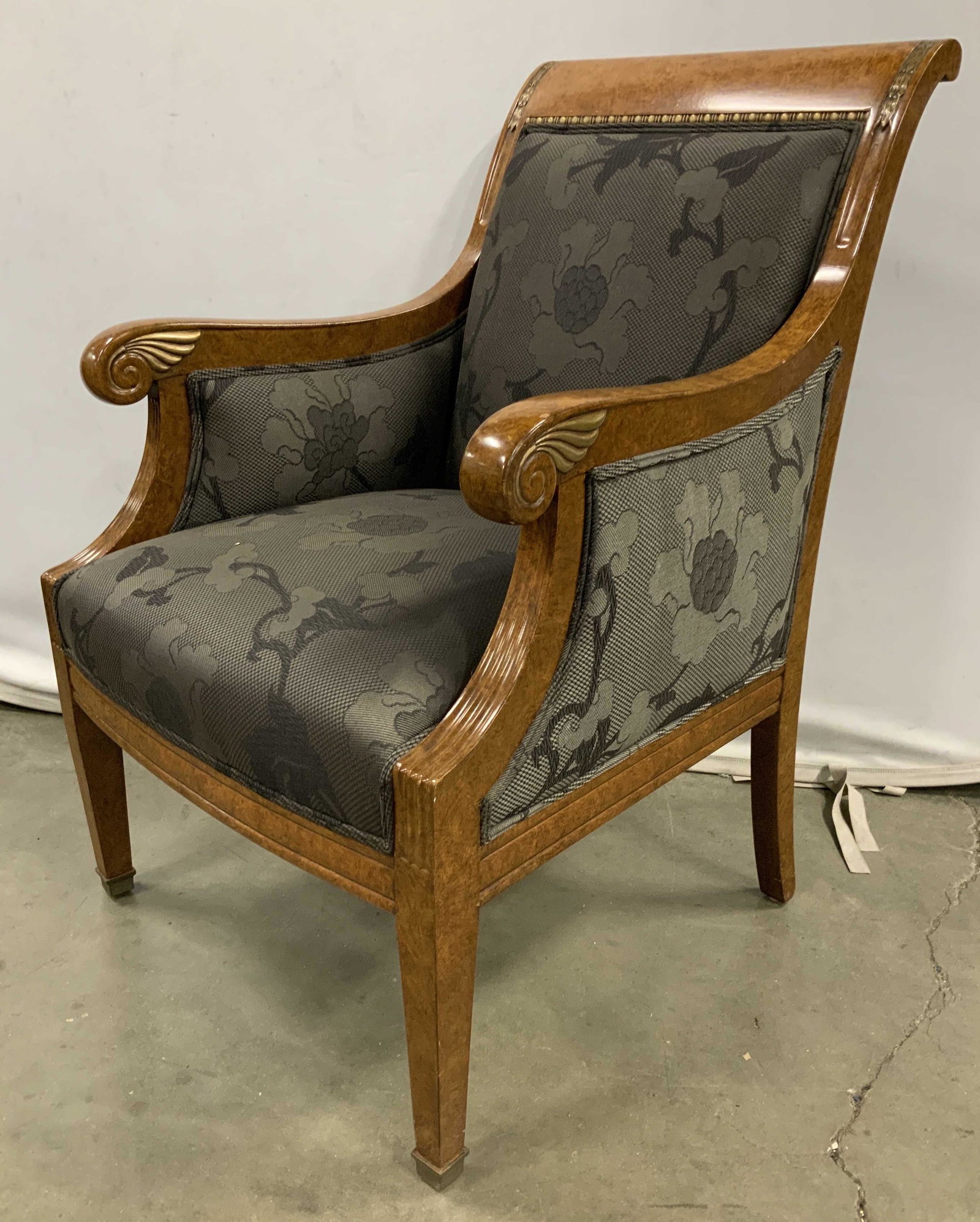 Antique Russian Regency Style Arm Chair: Occasional chair in Antique Russian Regency Style, maple toned burled wood, highly polished glossy finish, gilded metal ormolu detailing at corners, striping around frame, and scrolled winged design a