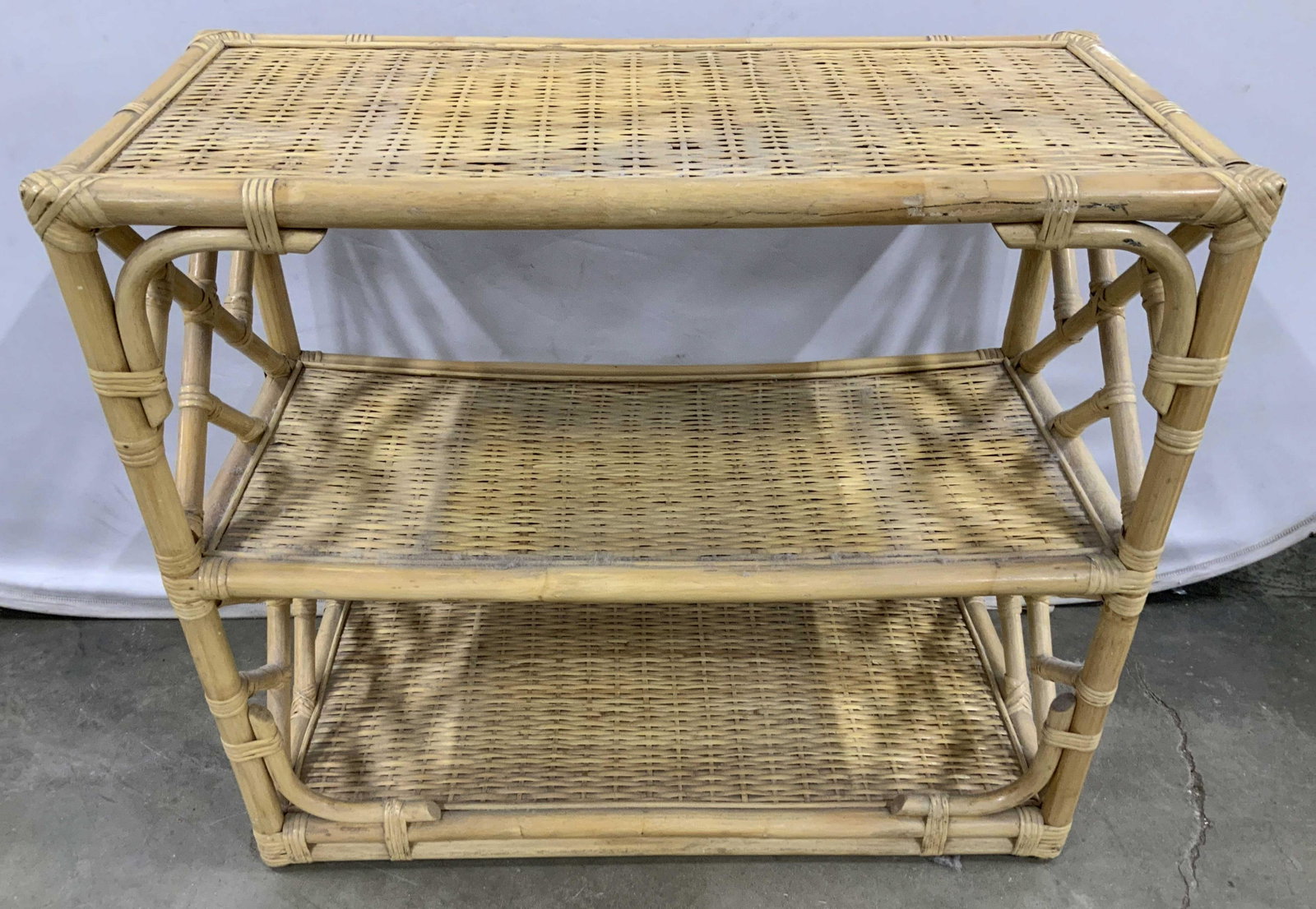 3 Tier Bamboo Rattan Wicker Shelf Unit: Piece measures ht 30 inches, length 34 inches depth 16 inches, has some wear, fading, shelf unit, console table, side table, display, storage