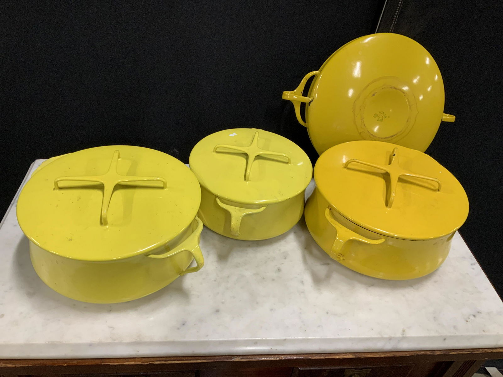 Group 7 Vintage DANSK enamel Ware, Denmark: Metal cook ware from DANSK, made in Denmark, three lidded pots, with handles, and one open dish, yellow and tangerine tones, cook ware, bake ware, oven to table, danish kitchenware, mid century kitche